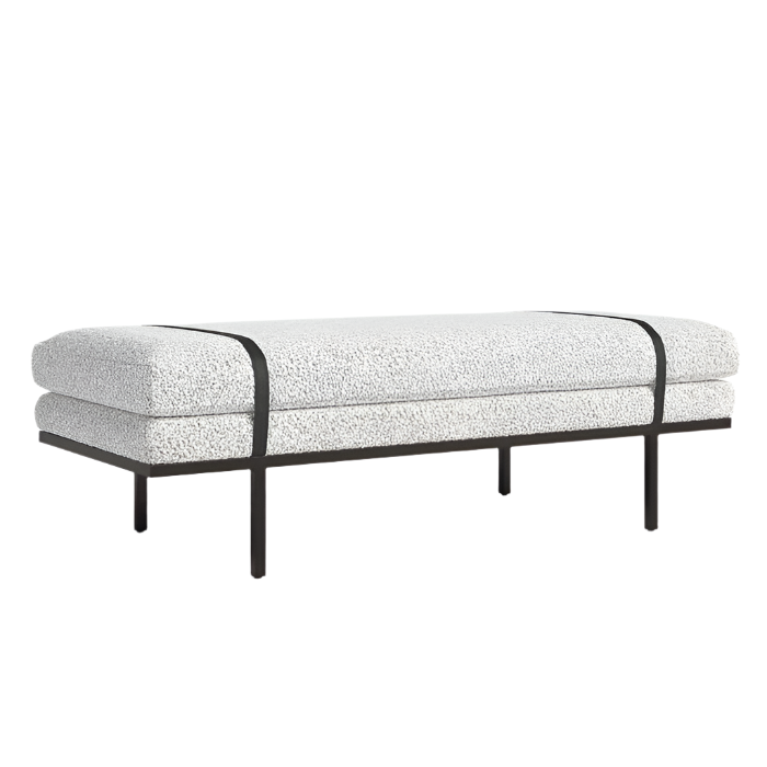 59-inch end-of-bed bench upholstered in off-white boucle fabric over a natural-toned frame, featuring two black straps across the cushion and a slim dark-finished solid wood base with four narrow legs.
