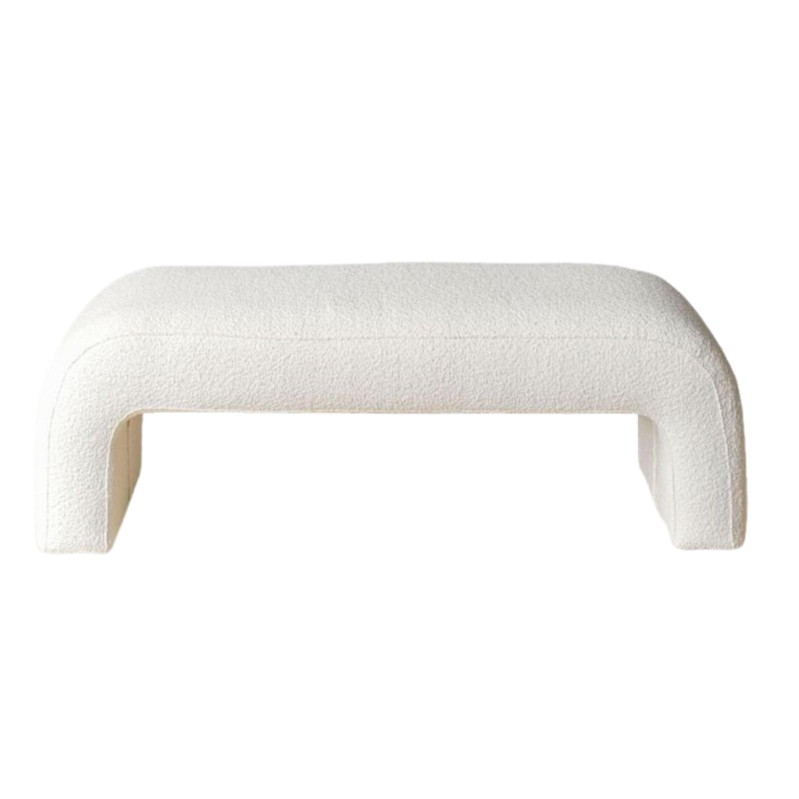 75-inch cream boucle upholstered end-of-bed bench with a rounded low-profile silhouette and integrated arch-style legs, shown isolated on a white background.