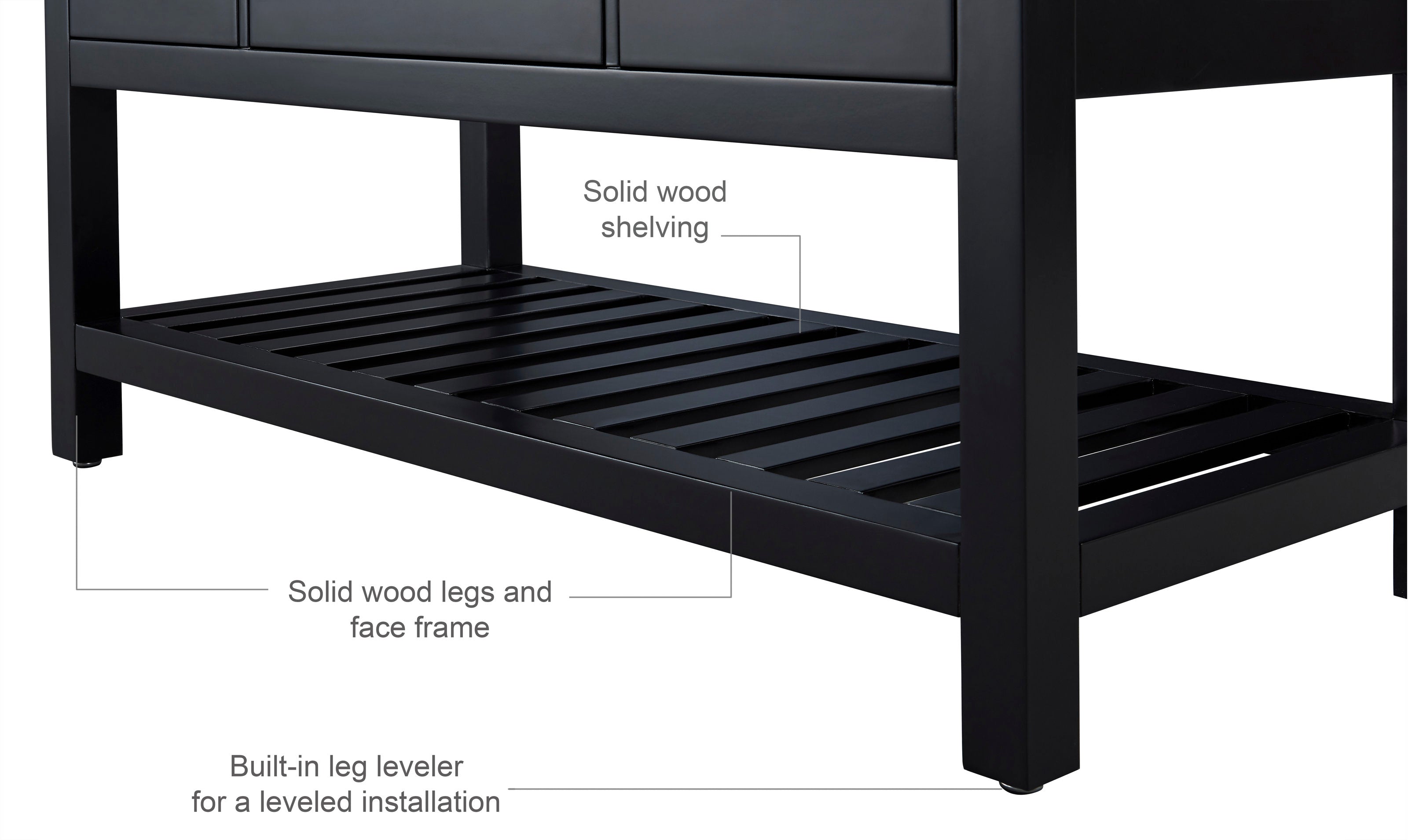 Close-up of a black solid wood bathroom vanity lower section showing the open slatted shelf, square legs, face frame and built-in leg levelers in a modern freestanding design.