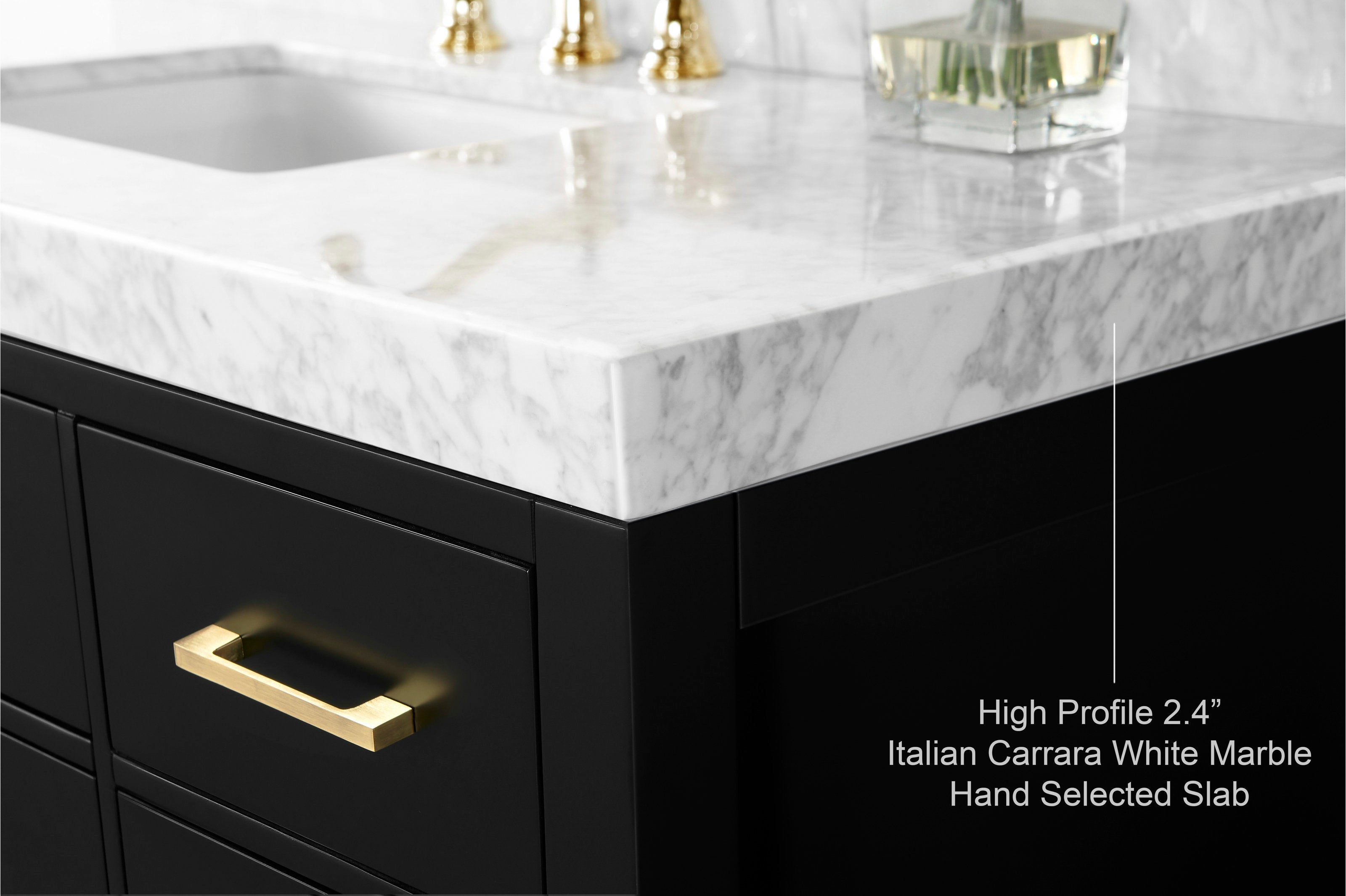 Close-up of a white Italian Carrara marble 2.4 in high-profile countertop corner on a black solid wood single-sink vanity, showing veined stone surface, undermount sink edge and a brushed gold rectangular drawer pull.