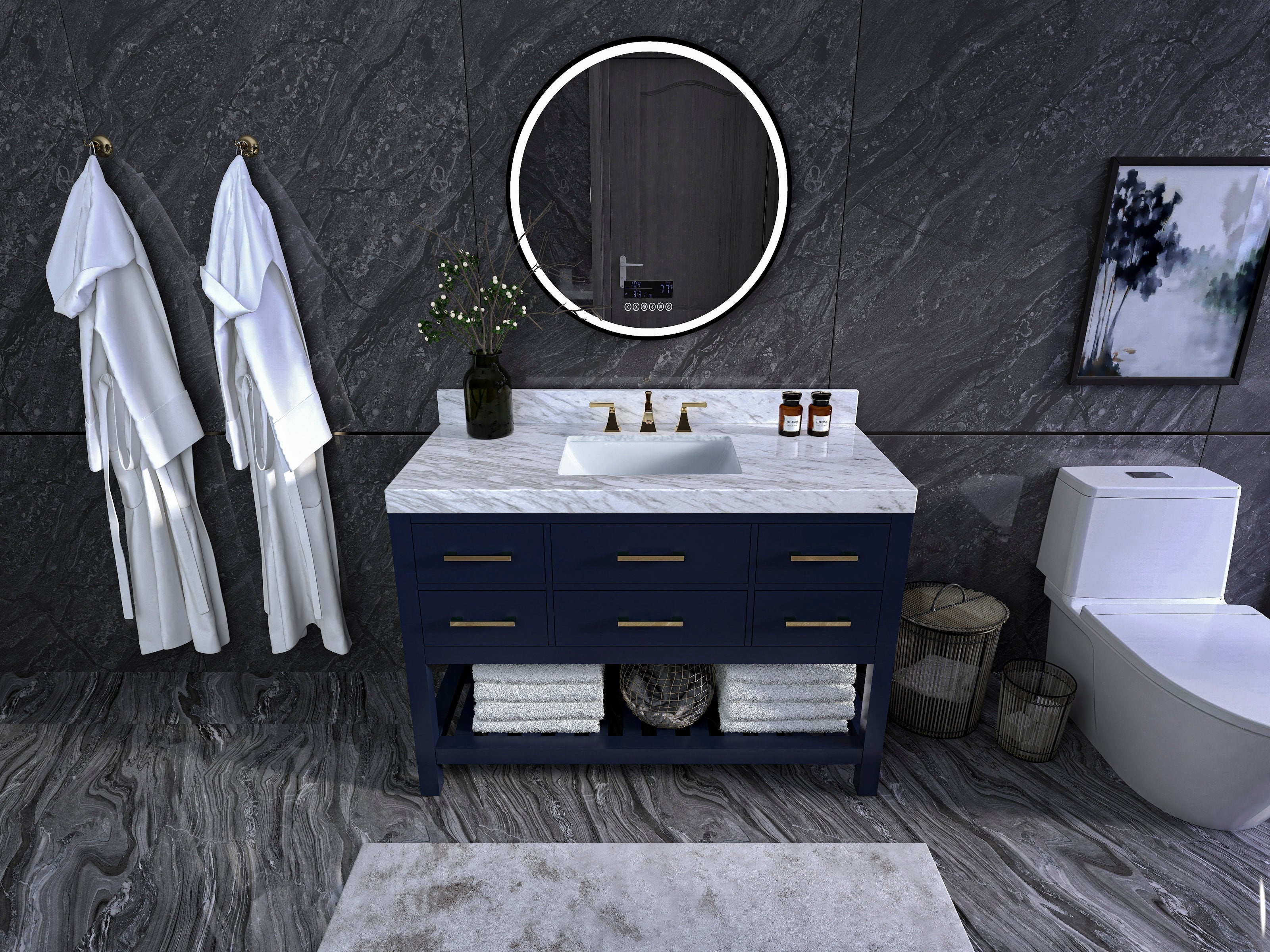 48-inch navy solid-wood bathroom vanity with marble stone top and white ceramic undermount sink, brass faucet and drawer pulls; round illuminated mirror above, robes and folded towels on shelf, dark stone walls and toilet to the right.