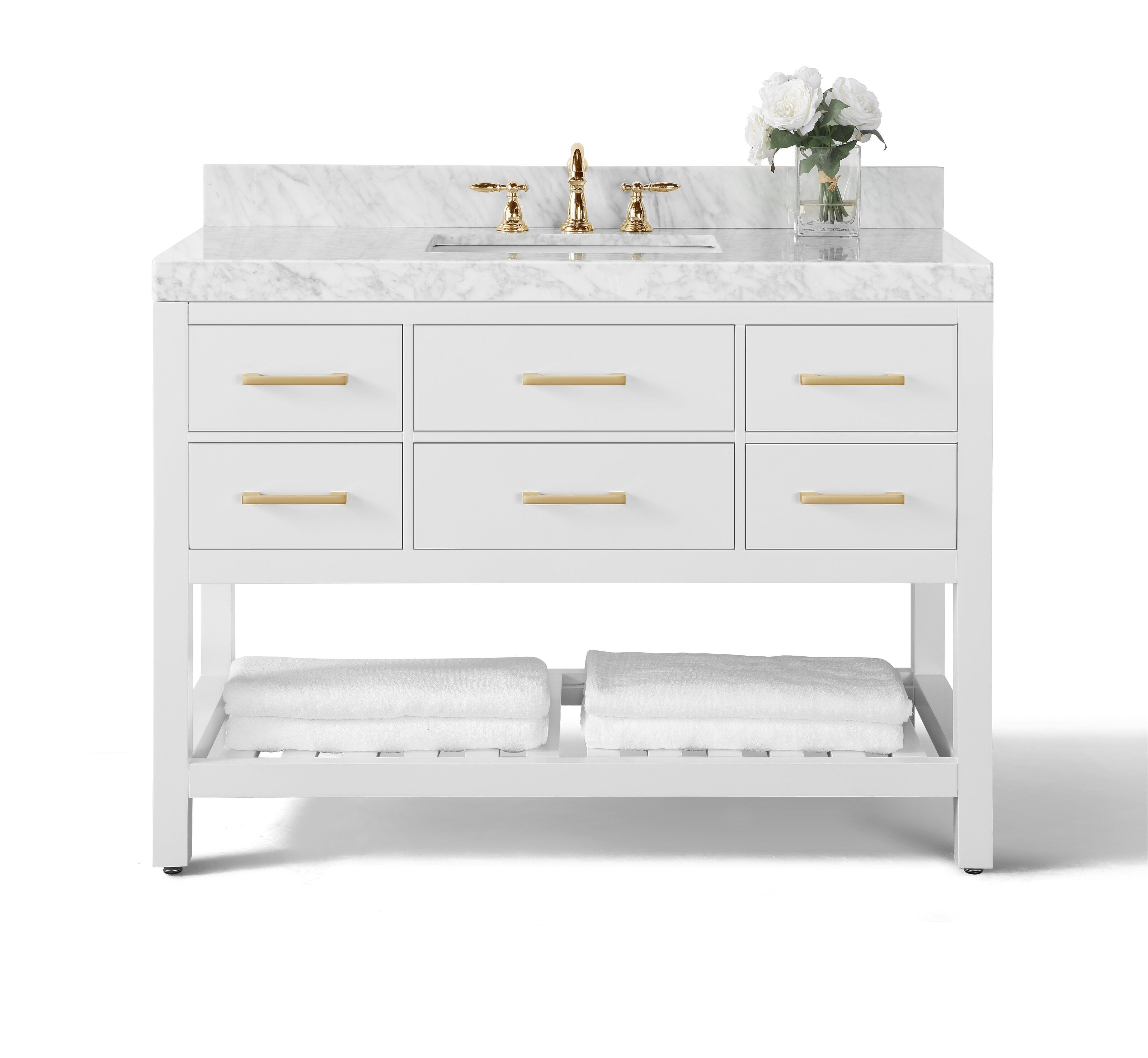 Modern 48-inch solid wood single-sink vanity in stone finish with a white marble top, brass faucet and matching gold drawer pulls, undermount ceramic sink, six drawers and open lower shelf with folded white towels.