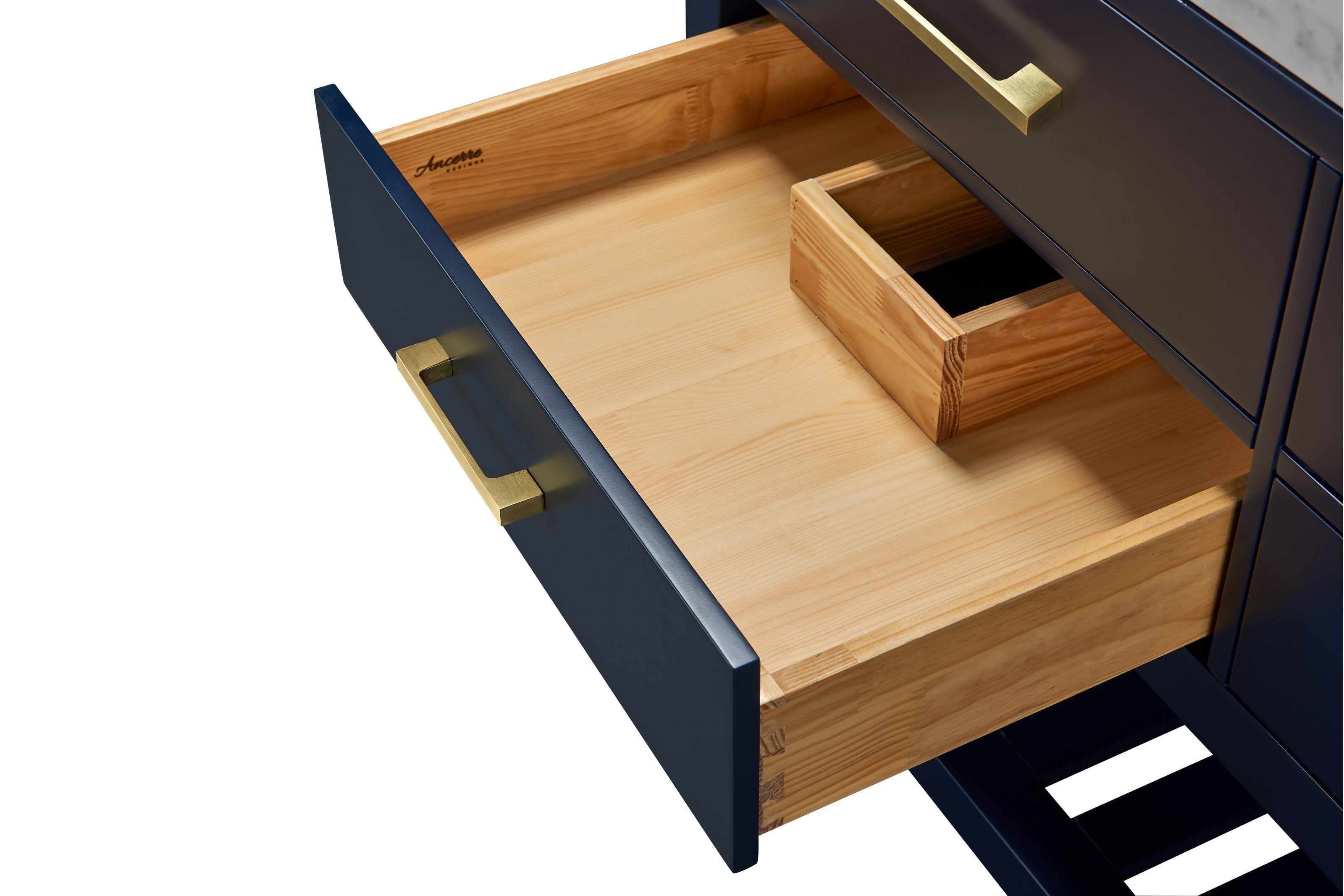 Open drawer of a 48-inch contemporary bathroom vanity showing natural solid wood interior with dovetail joints and small wood tray, paired with a stone-colored painted front and a brushed brass pull handle.