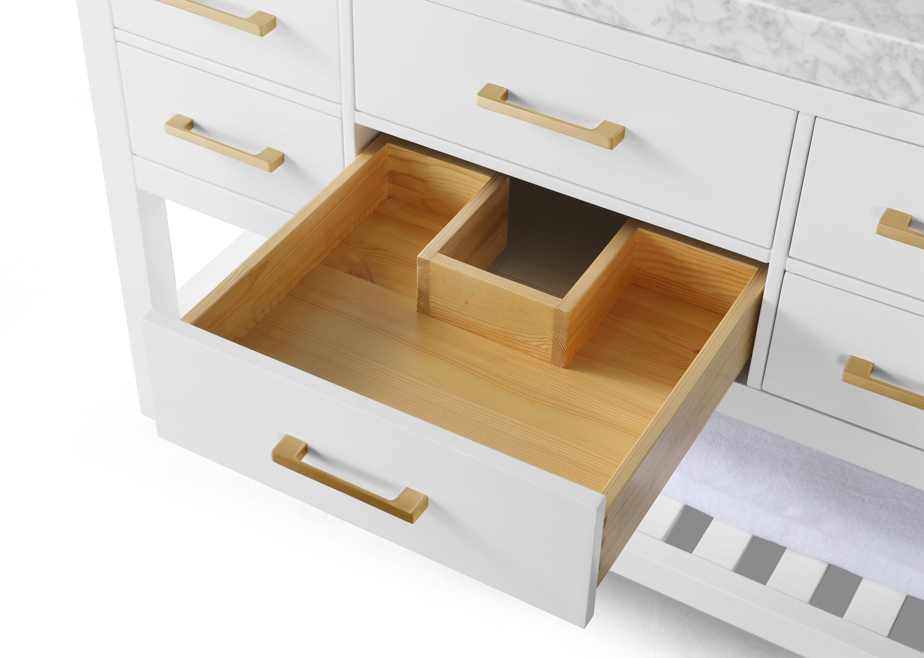 Close-up of a modern white bathroom vanity with a stone marble top, an open drawer revealing natural solid wood interior and center organizer, accented by brushed gold handles.