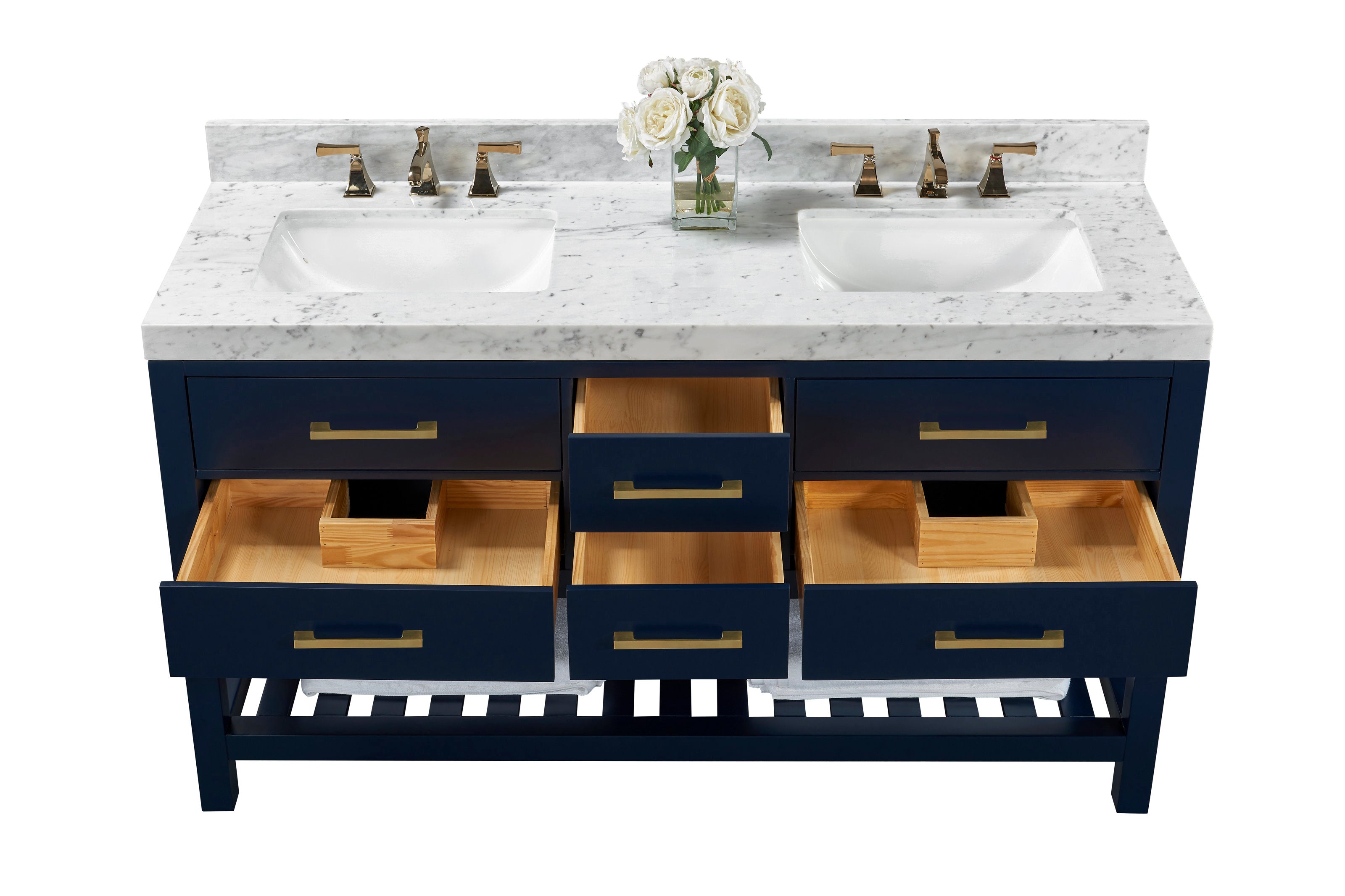 Contemporary 60-inch double-sink vanity with a white stone marble top, two undermount ceramic sinks, brass faucets and pulls, navy solid-wood base with open drawers showing natural wood interiors and a slatted lower shelf with towels.