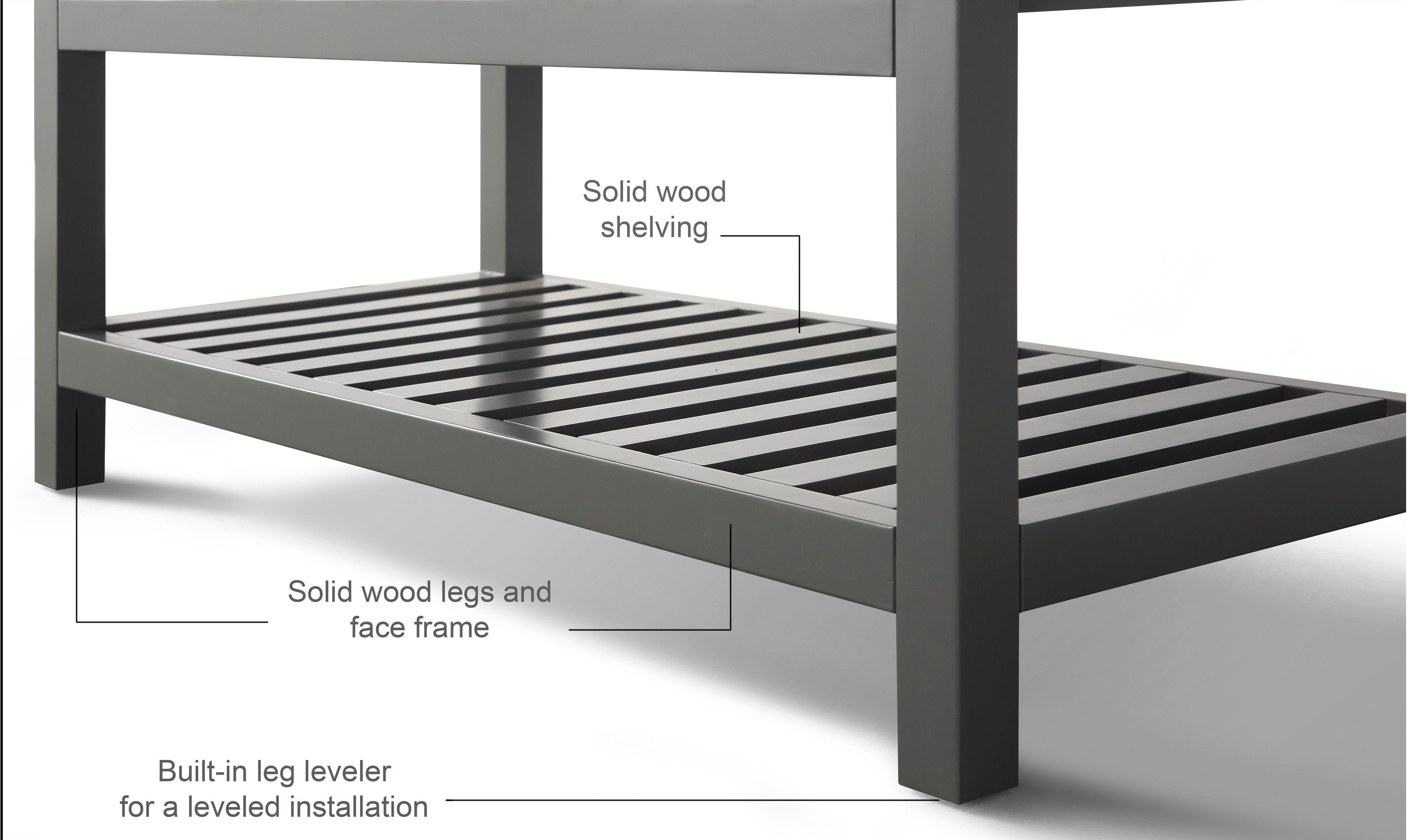 Close-up of a stone-colored solid wood bathroom vanity base showing a slatted lower shelf, square legs and face frame in a modern contemporary style, with a built-in leg leveler for a leveled freestanding installation.