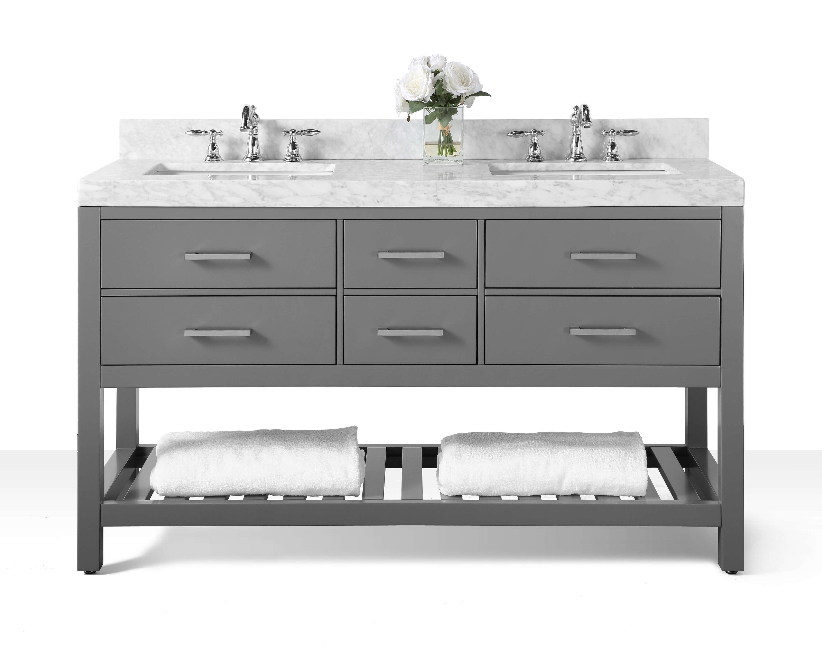 Modern stone-colored solid wood 60-inch double-sink bathroom vanity with marble top, two chrome faucets, six drawers, open slatted shelf with rolled white towels and a glass vase of white roses.