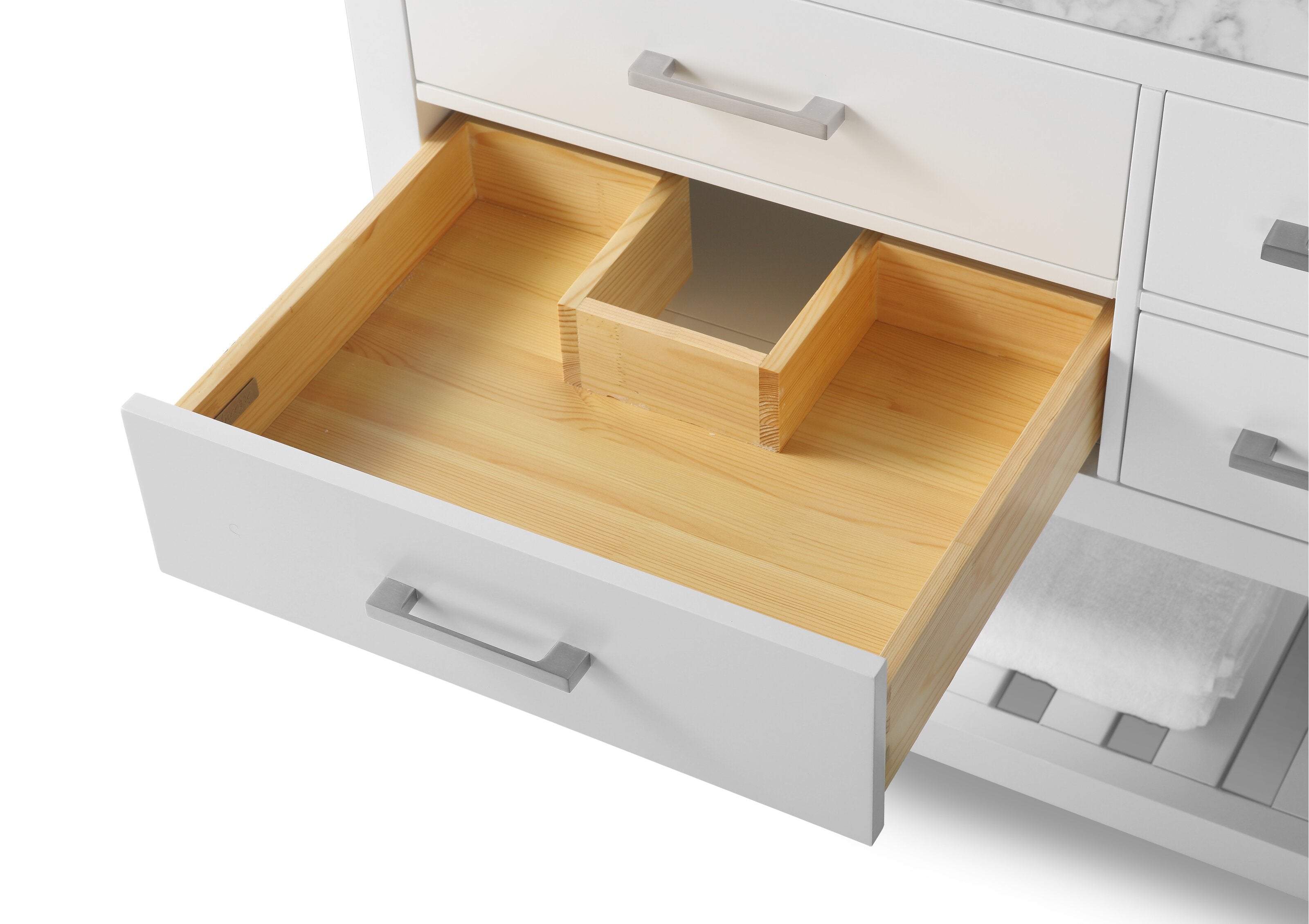 Open white modern bathroom vanity drawer showing natural solid wood interior with a U-shaped plumbing cutout, stone countertop edge above, and a brushed metal drawer pull on the painted front.