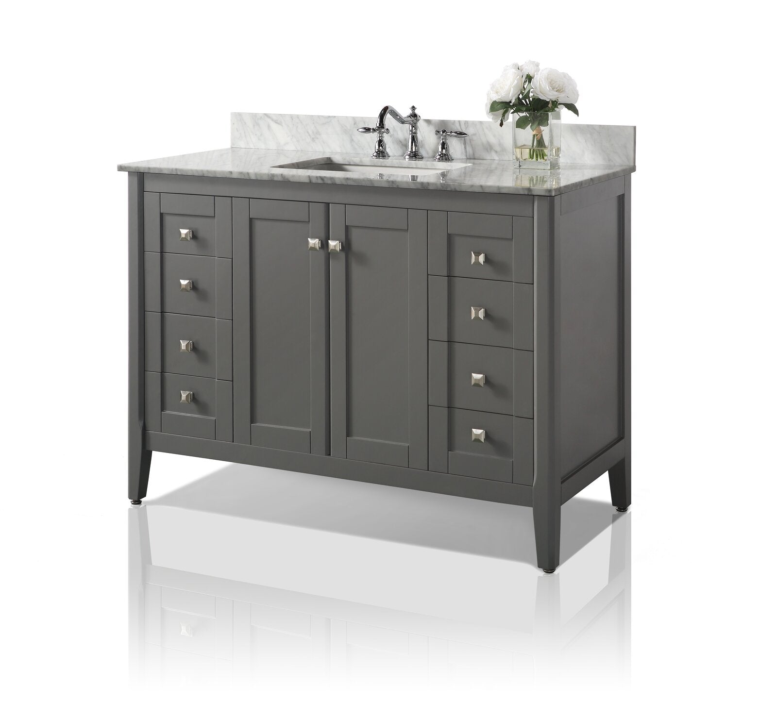 Freestanding 48-inch modern bathroom vanity in stone-gray solid wood with a white marble top, integrated ceramic undermount sink and chrome faucet; double center cabinet doors flanked by stacked drawers with square metal knobs and a vase of white flo