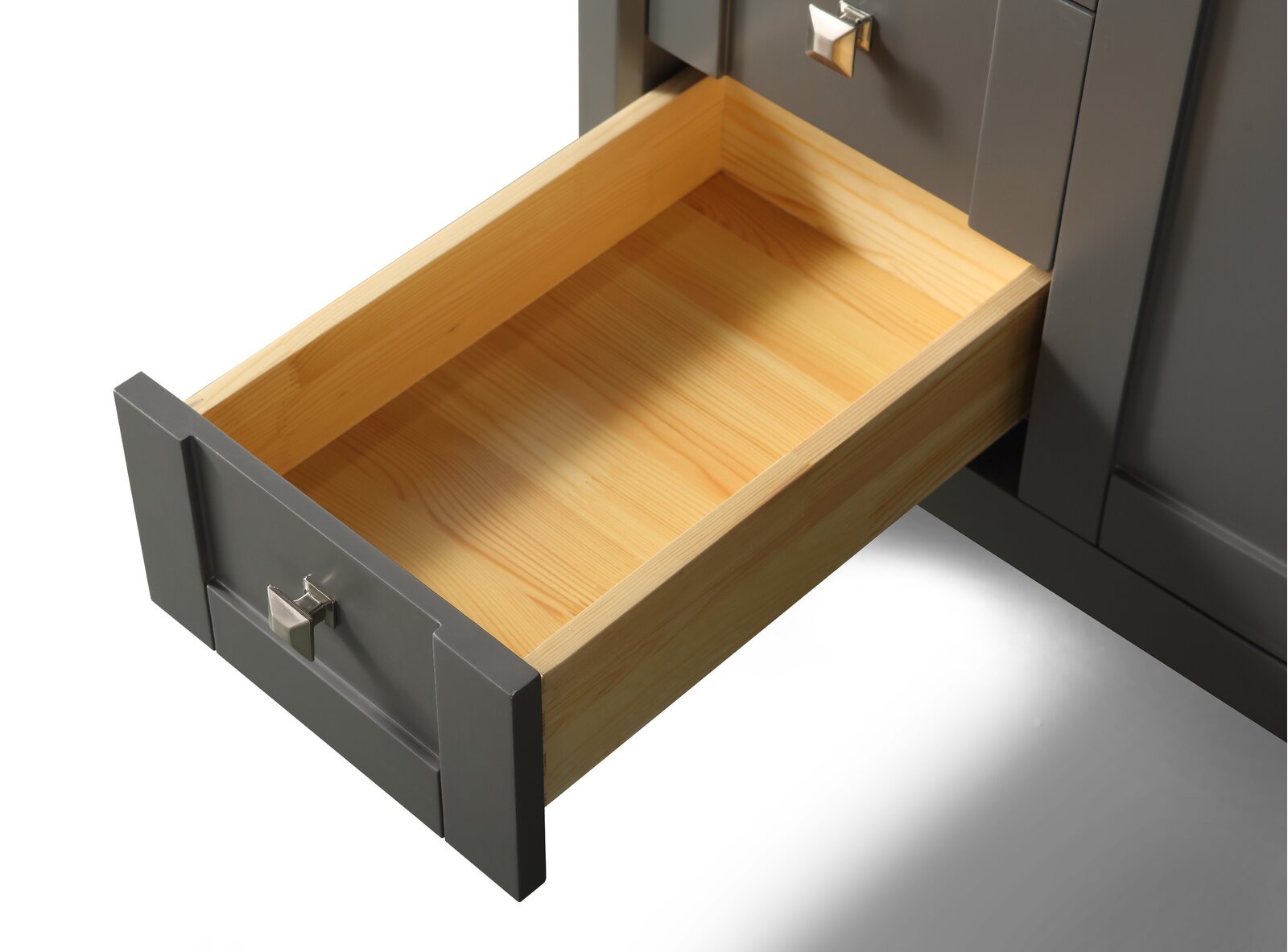 Open light-wood drawer with visible natural pine grain inside a stone-colored modern bathroom vanity, featuring a gray painted drawer front and a square brushed-metal knob.