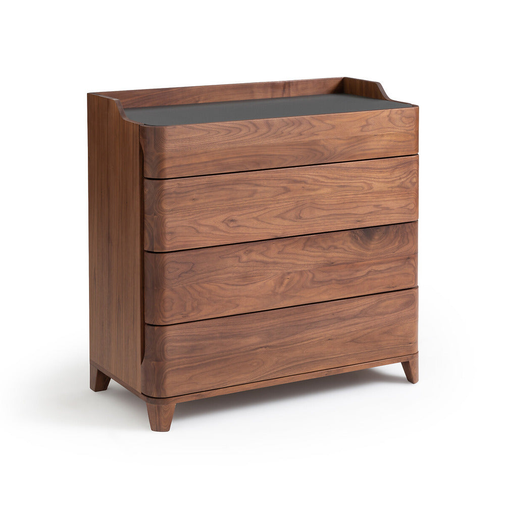 Contemporary four-drawer walnut dresser with rounded drawer fronts, tapered legs and a black linoleum top tray shown on a white background.