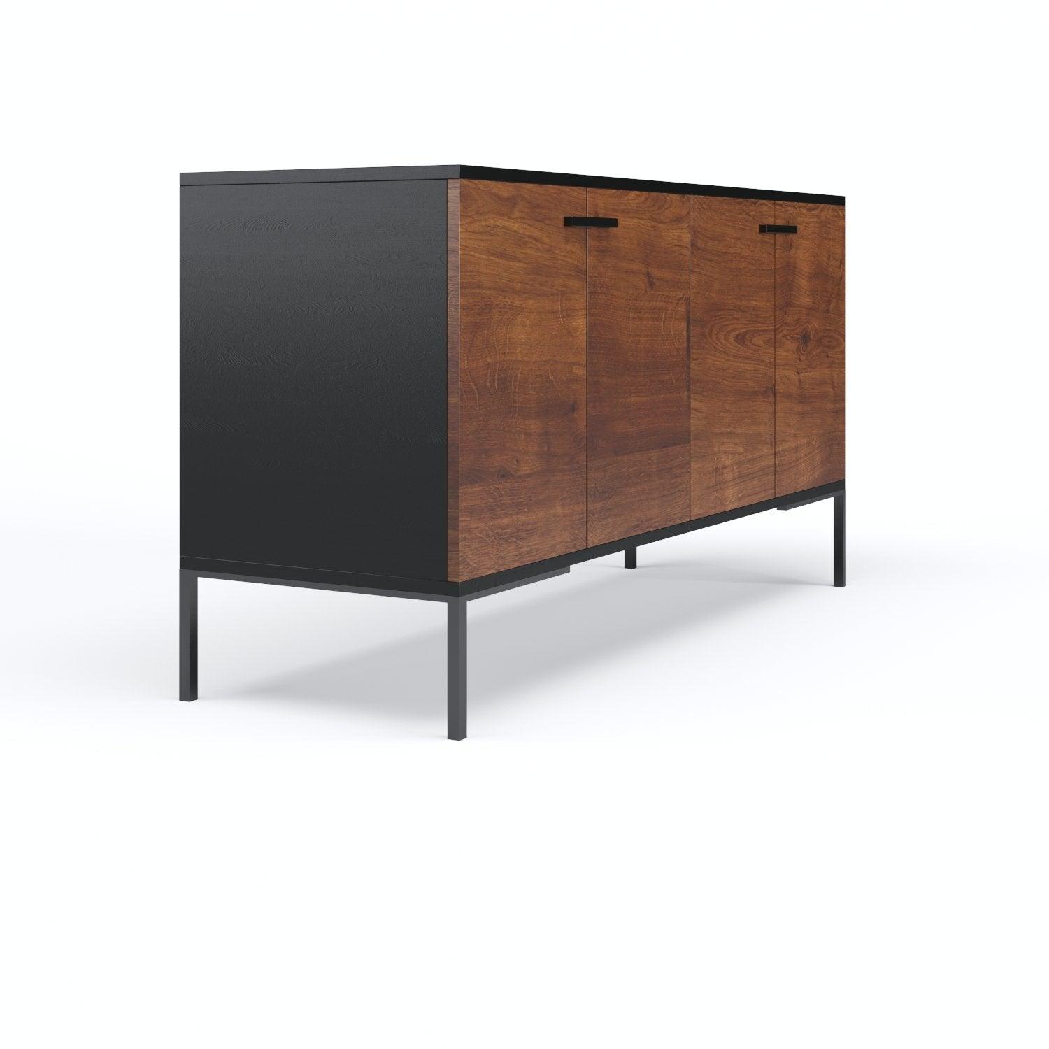 Angled view of a mid-century modern teak sideboard with warm teak doors, matte black sides and top, slim black iron legs and four doors with minimalist black bar handles.