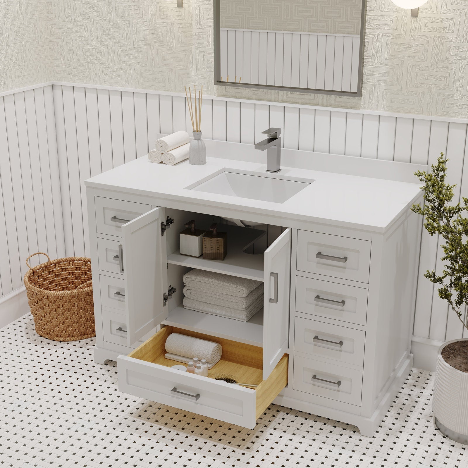 Modern stone-top solid wood bathroom vanity in stone color with integrated rectangular ceramic sink, single-handle chrome faucet, open center cabinet with folded towels and a partially open wooden drawer showing toiletries.