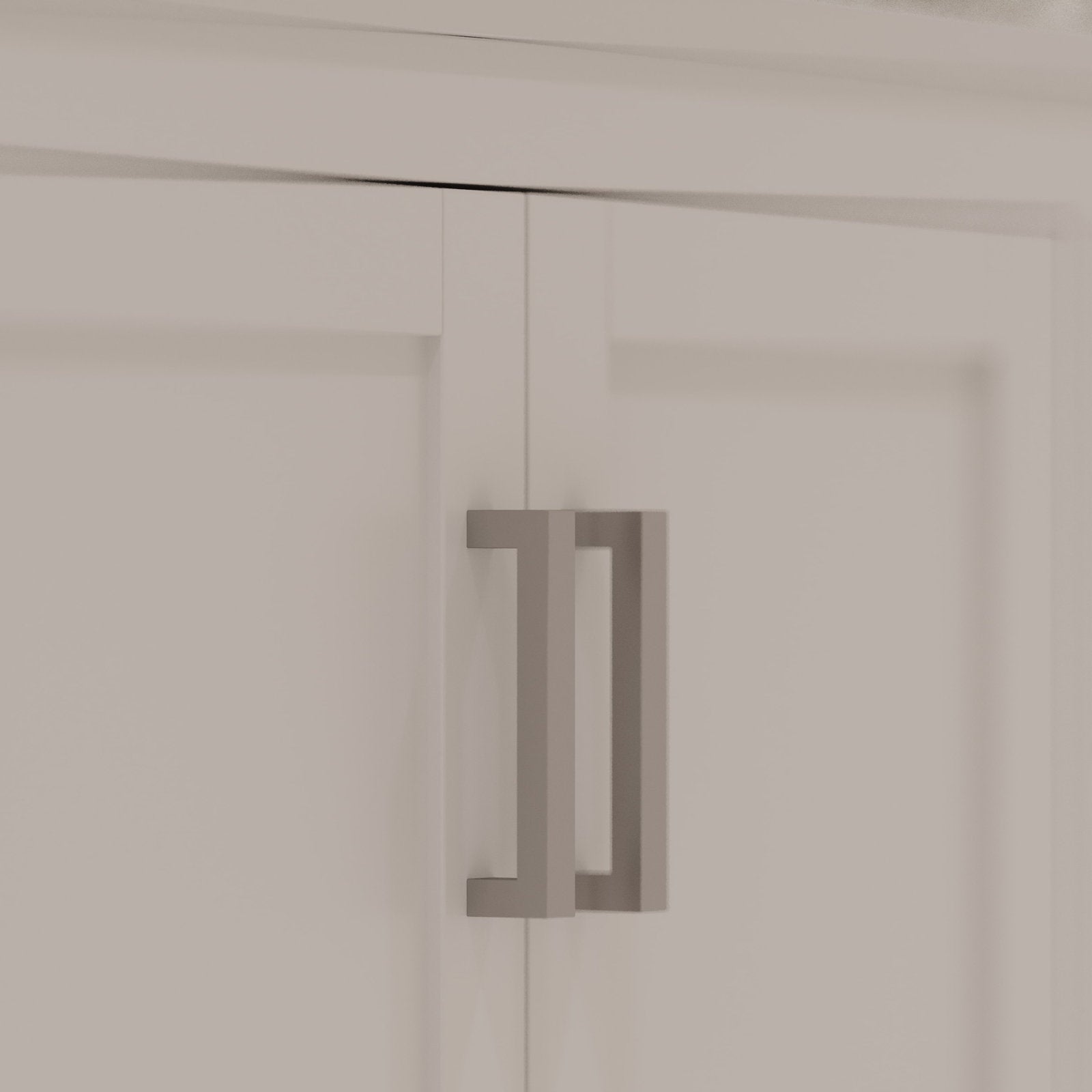 Close-up of a stone-colored bathroom vanity double door showing a modern rectangular matte-gray metal pull handle mounted on recessed solid wood panels.