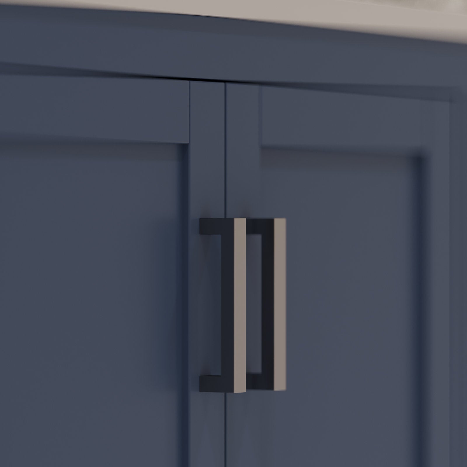 Close-up of stone-colored solid wood vanity doors with a modern double rectangular metal pull finished in matte black sides and brushed nickel faces beneath a white countertop edge.