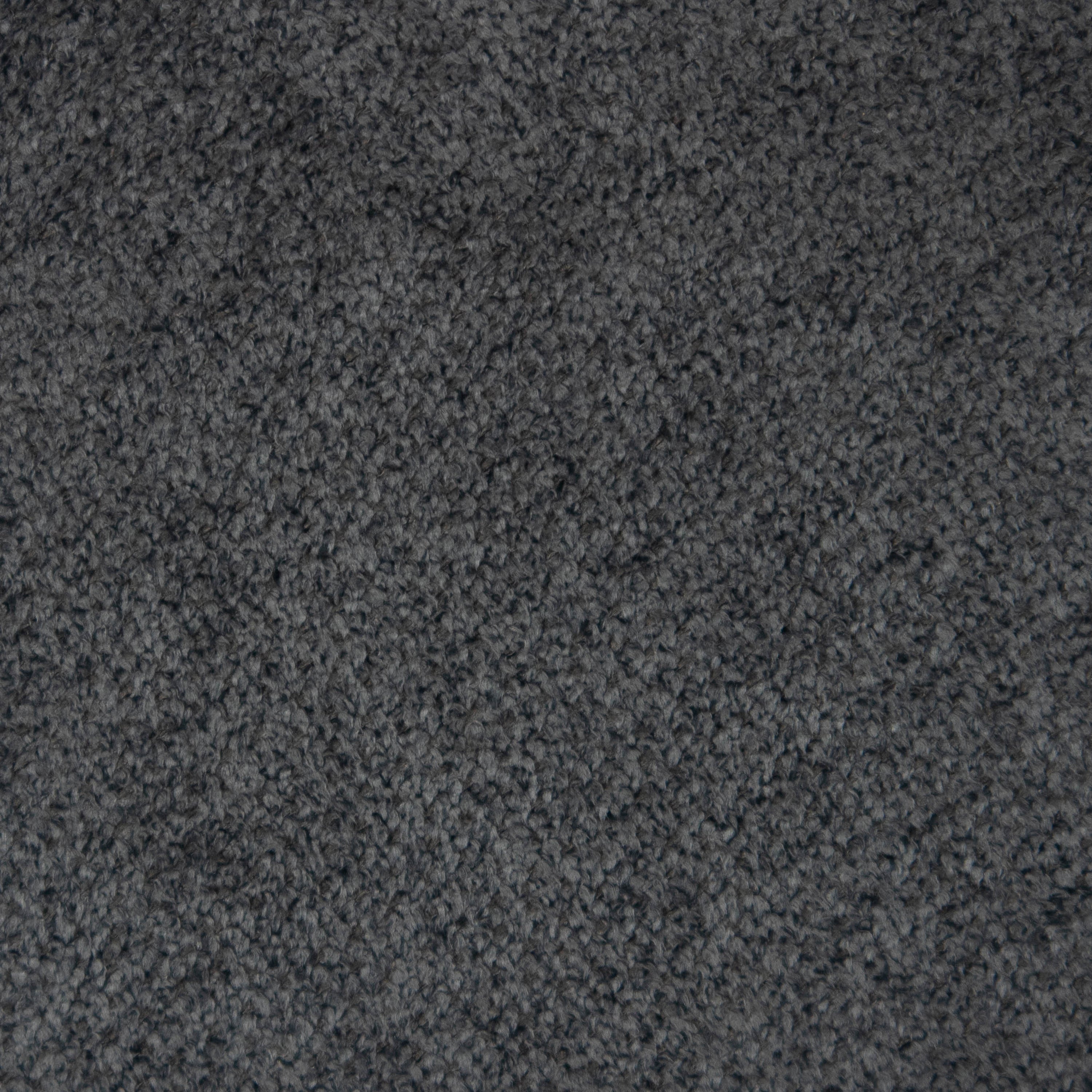 Close-up of charcoal bouclé fabric showing dense, looped texture used for bar and counter stool upholstery.