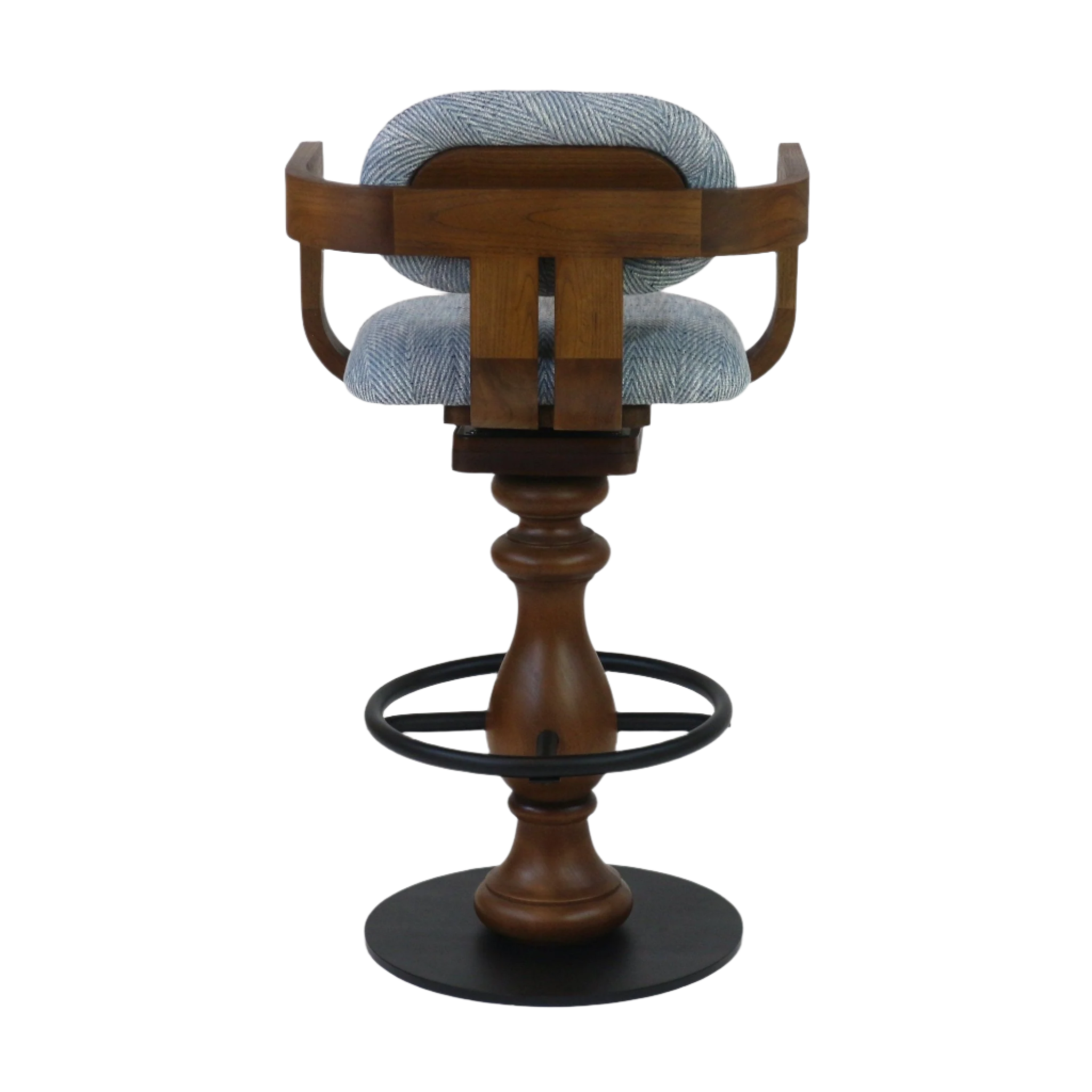Rear view of a contemporary swivel bar stool with light-gray herringbone fabric seat and back, curved warm-wood frame and turned wood pedestal, plus a black metal footrest ring and round metal base.
