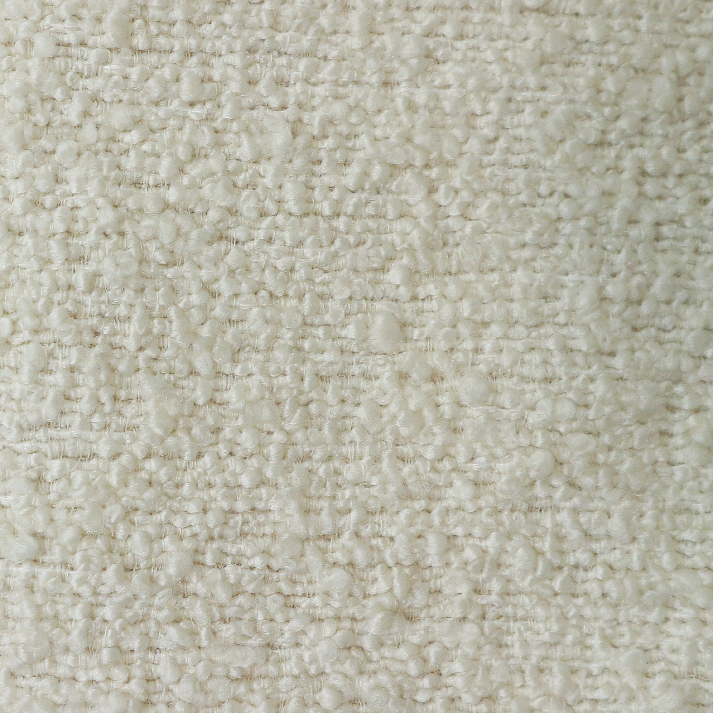 Close-up of cream boucle upholstery fabric showing soft nubby loops and woven texture in a neutral tone, ideal for modern upholstered dining chairs.
