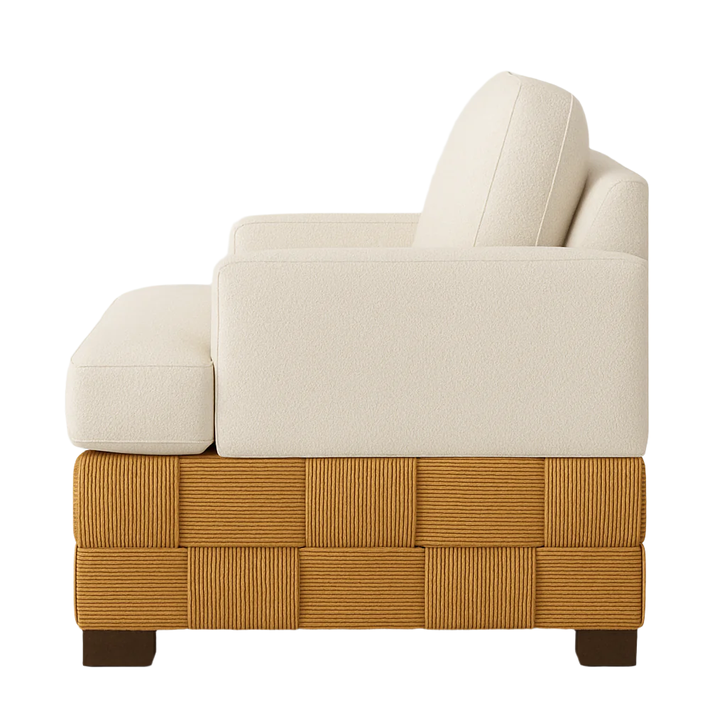 Side view of a modern accent chair upholstered in cream boucle fabric with boxy arms and cushions, set on a woven natural wood base featuring square braided detailing and dark wooden feet.