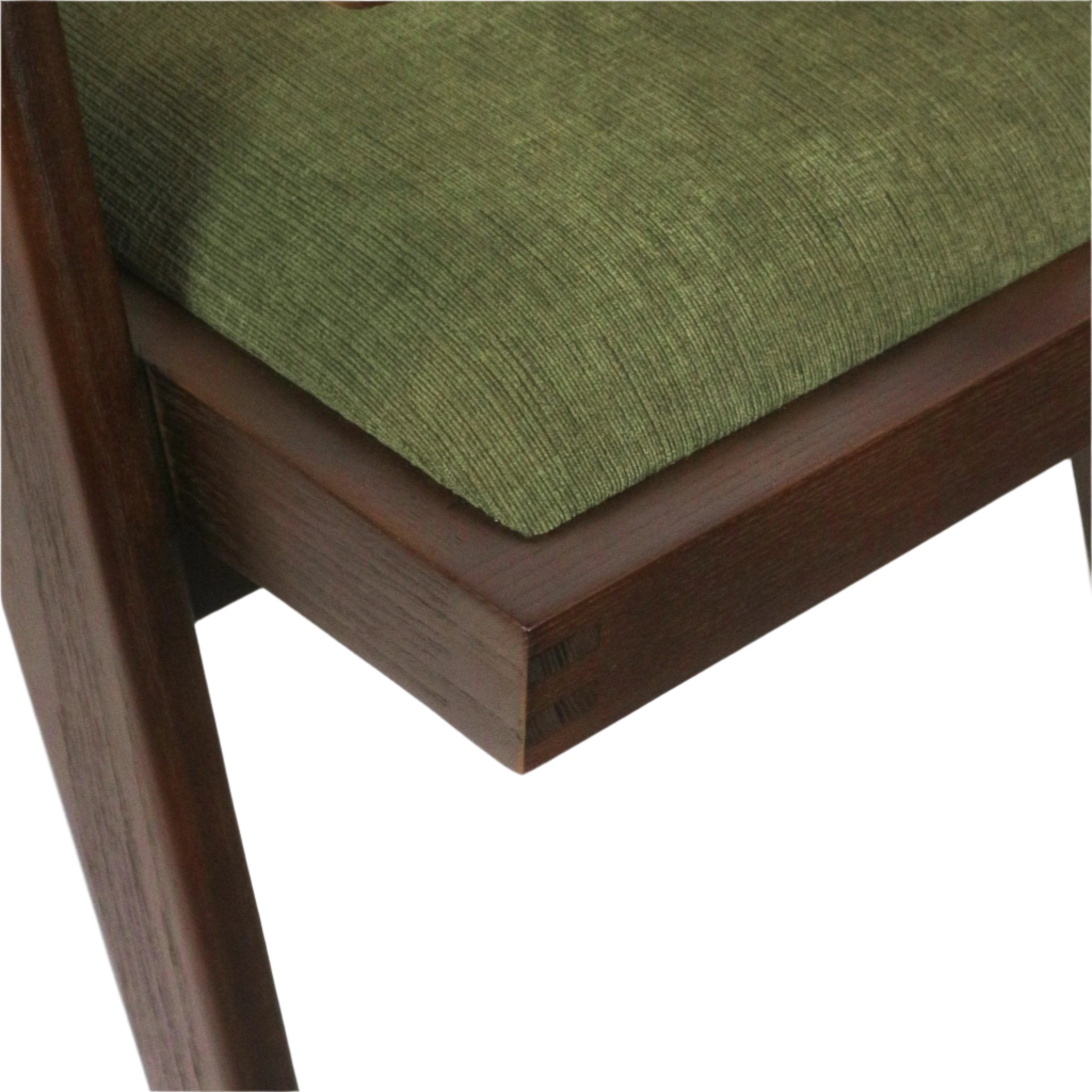 Close-up of a green textured upholstered seat cushion on a dark walnut solid-wood frame, showing exposed corner joinery and a tapered leg in a mid-century modern style.