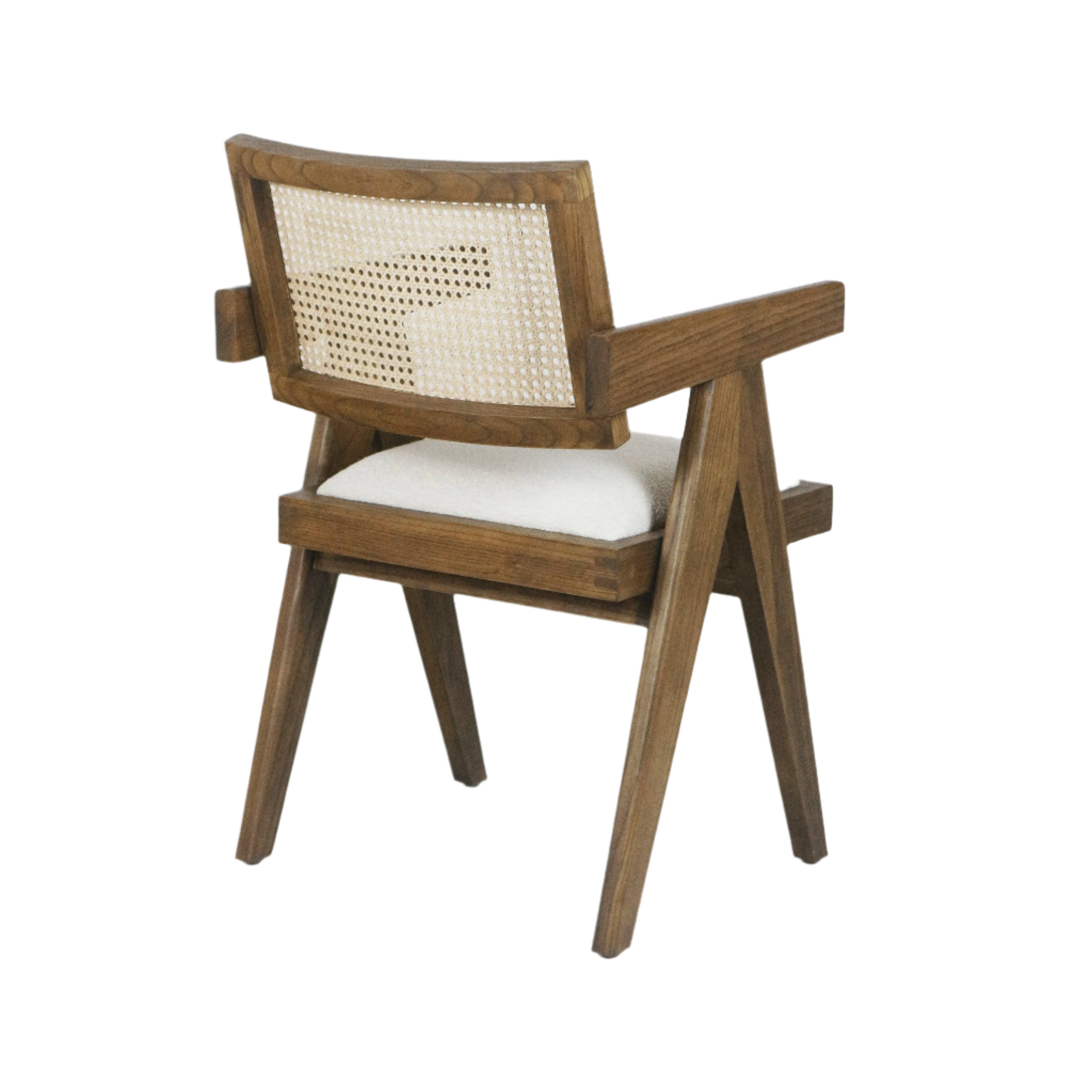 Mid-century modern natural wood dining chair with woven cane back, angled A-frame legs, squared wooden arms and a cream upholstered seat cushion.