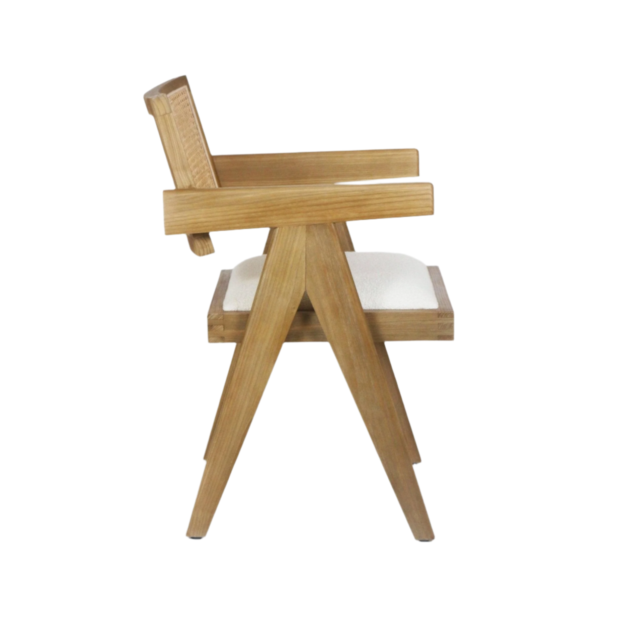Side view of a natural wood mid-century modern dining chair featuring a woven cane back, straight wooden arms, A-frame tapered legs and a white upholstered seat cushion.
