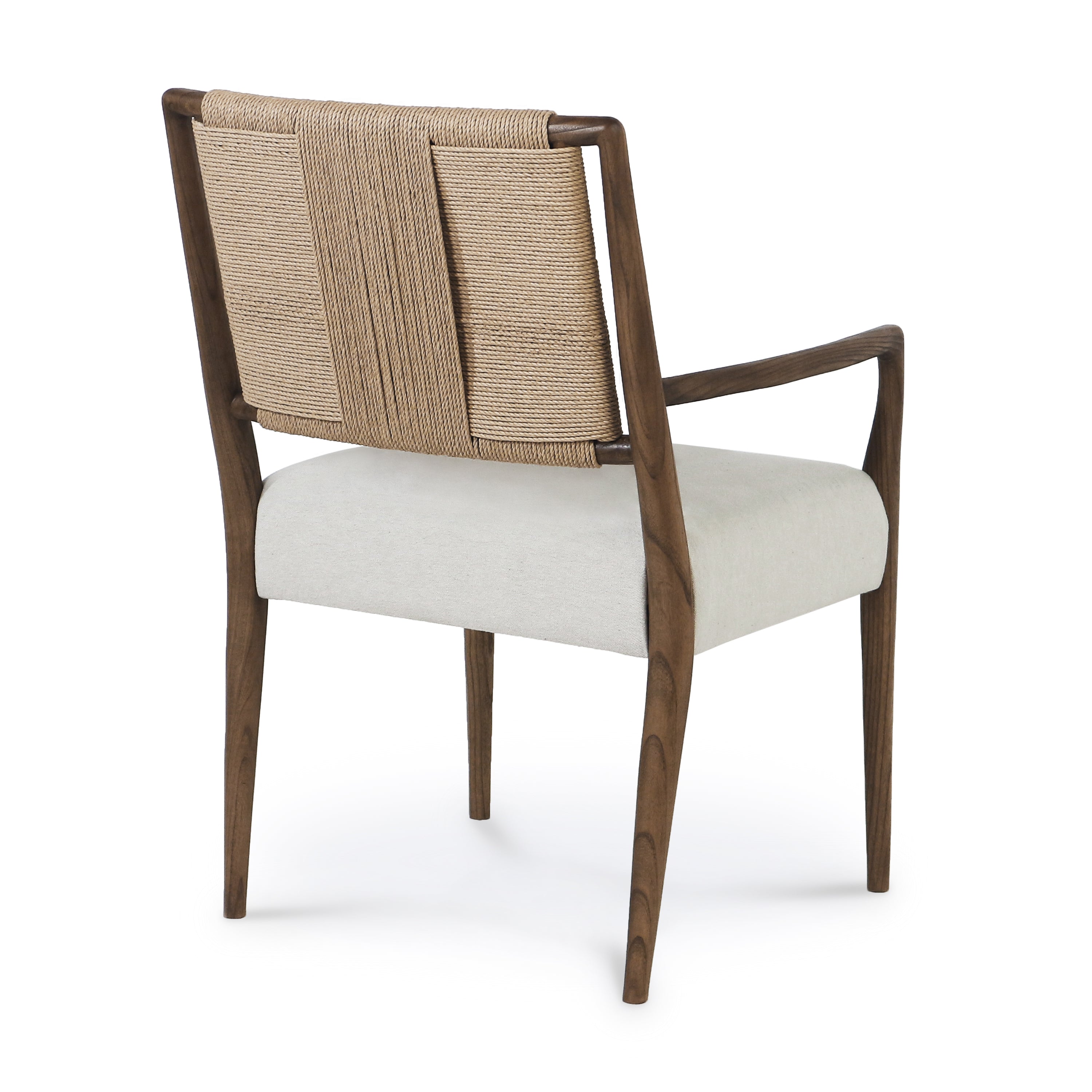 Rear three-quarter view of a natural solid wood armchair with arms, featuring a woven papercord back and a light beige upholstered seat on sculpted mid-century modern legs.