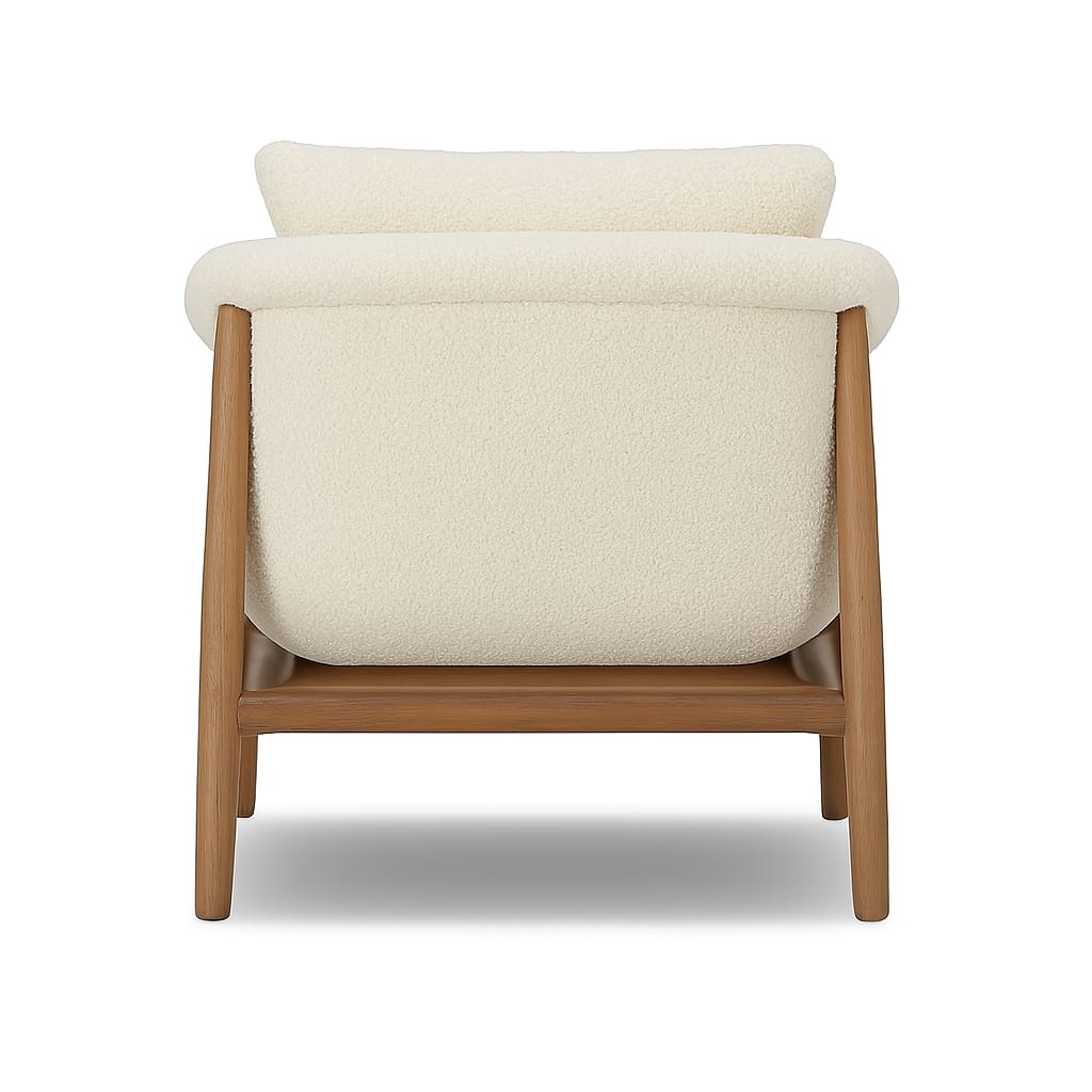 Rear view of a modern mid-century accent chair upholstered in cream boucle fabric with a natural wood frame and tapered legs, showing the rounded back cushion and wooden base.