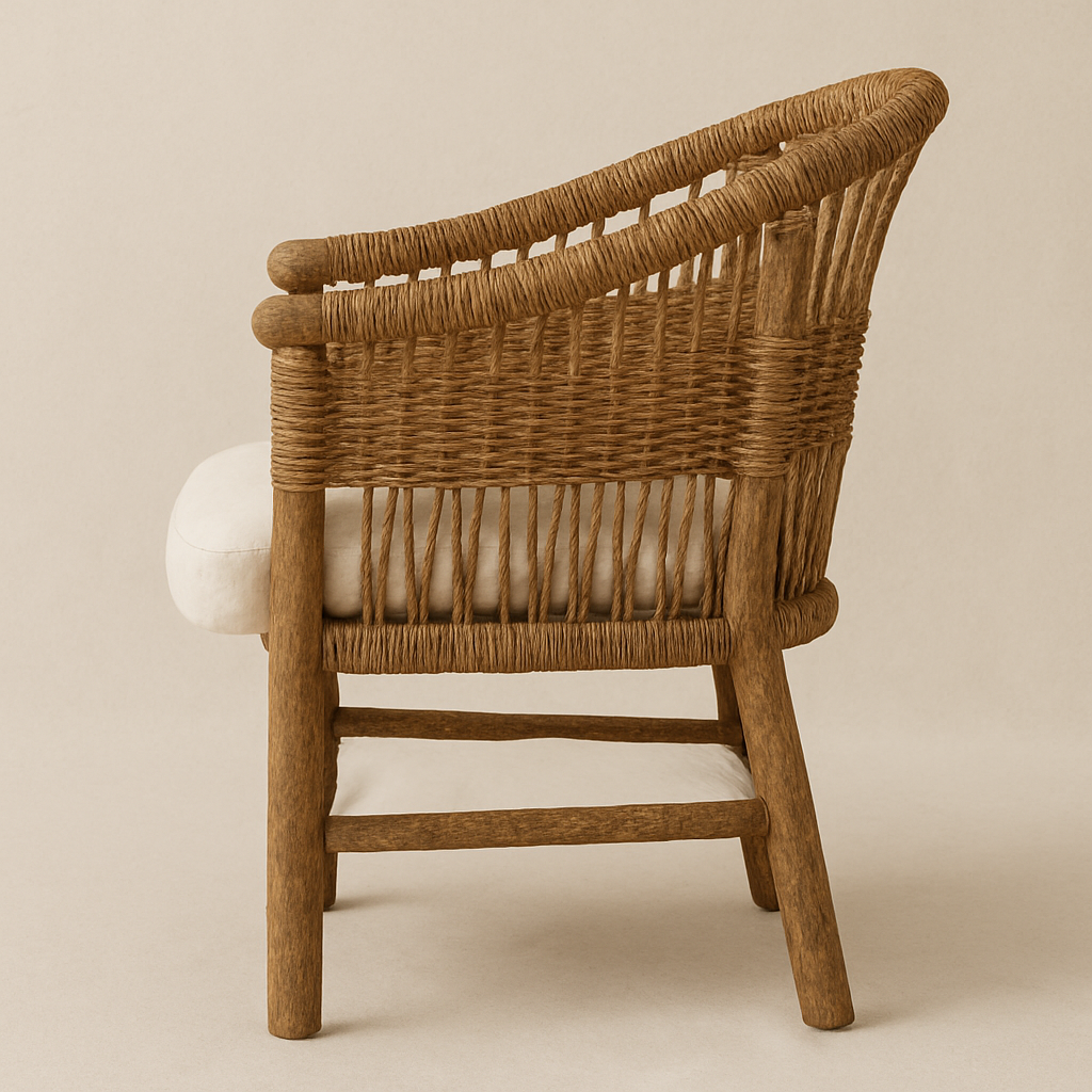 Side profile of a rustic woven rattan dining armchair with a natural solid wood frame and a beige upholstered seat cushion.