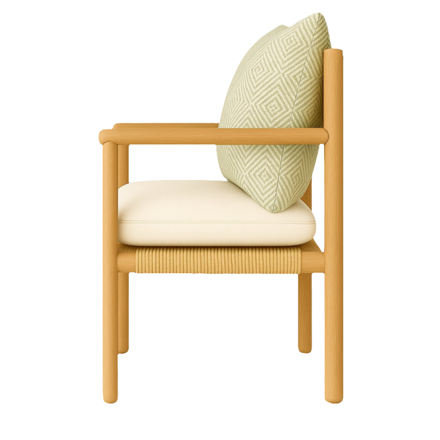 Side view of a Scandinavian dining chair with rounded oak frame, cream upholstered seat cushion, woven papercord seat apron and a pale green patterned back pillow.