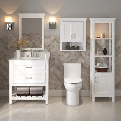 Contemporary white solid wood 31-inch single-sink bathroom vanity with stone countertop and chrome faucet, paired with a framed mirror, matching wall cabinet and tall linen tower next to a toilet, styled with towels and decor.
