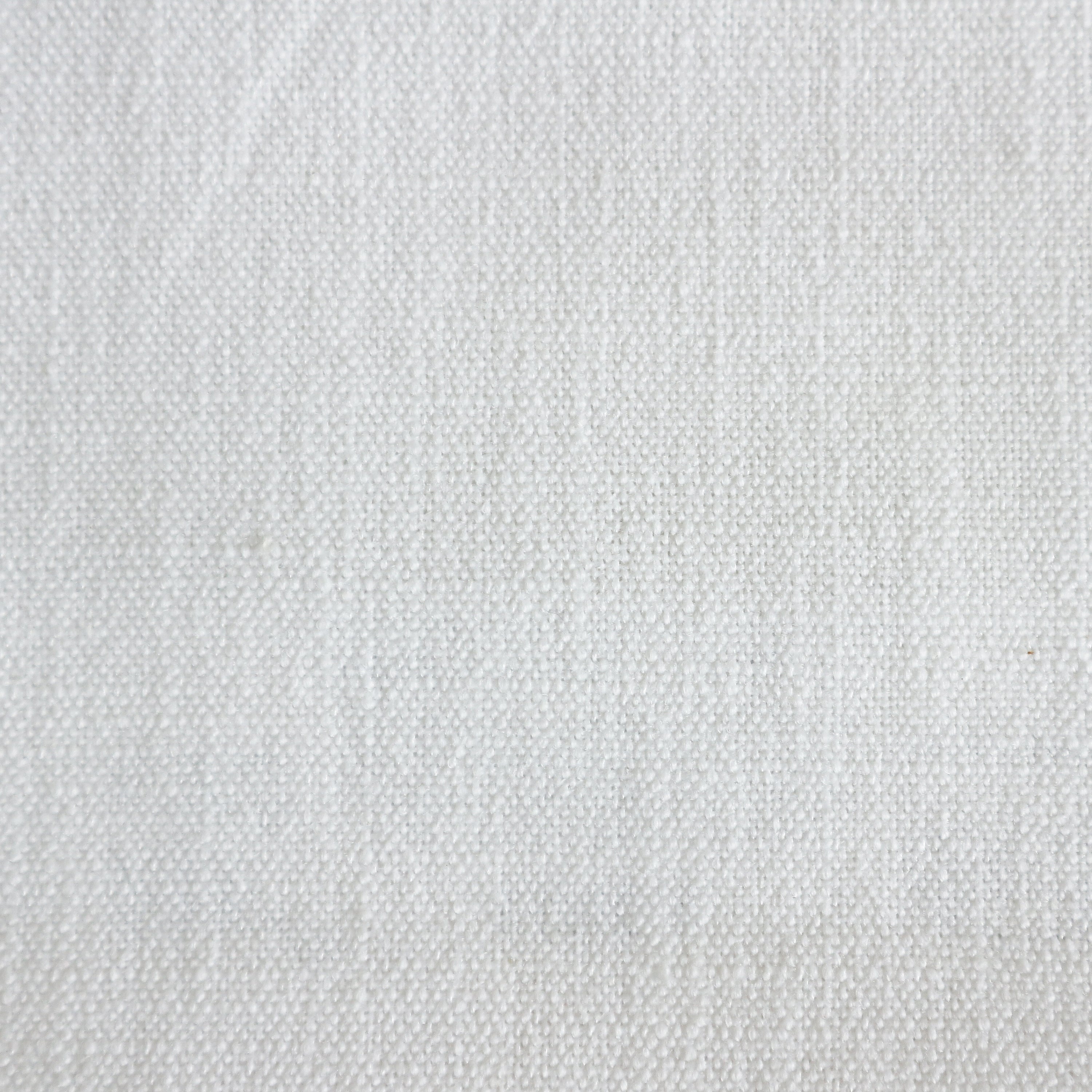 Close-up of natural cream woven fabric upholstery showing a tight, pebble-like texture used as the cushioned seat material for a rustic farmhouse bar counter stool.