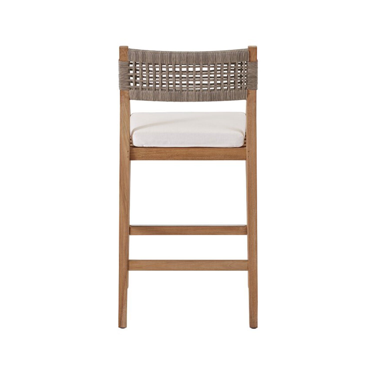 Rear view of a teak outdoor bar stool with a woven natural-fiber back, white fabric seat cushion and solid wood frame with footrest, coastal-style seating.