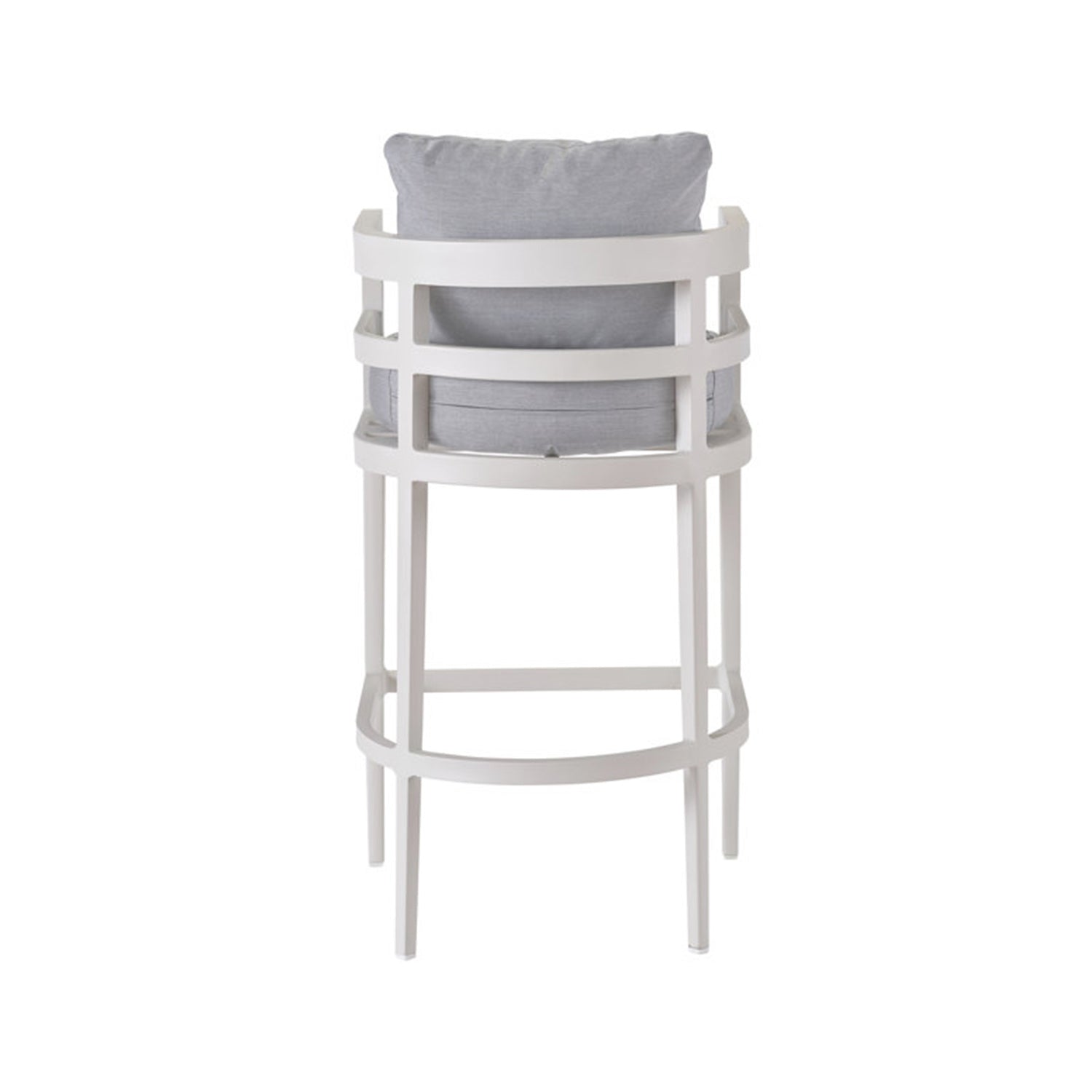 Rear view of a coastal outdoor bar stool with a natural teak frame and light gray upholstered back and seat cushion, curved slatted backrest, arm supports and integrated circular footrest.