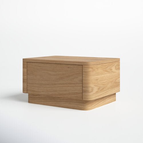 Minimal modern nightstand in natural oak solid wood, featuring a low-profile rectangular form with a rounded plinth base and a seamless front drawer.