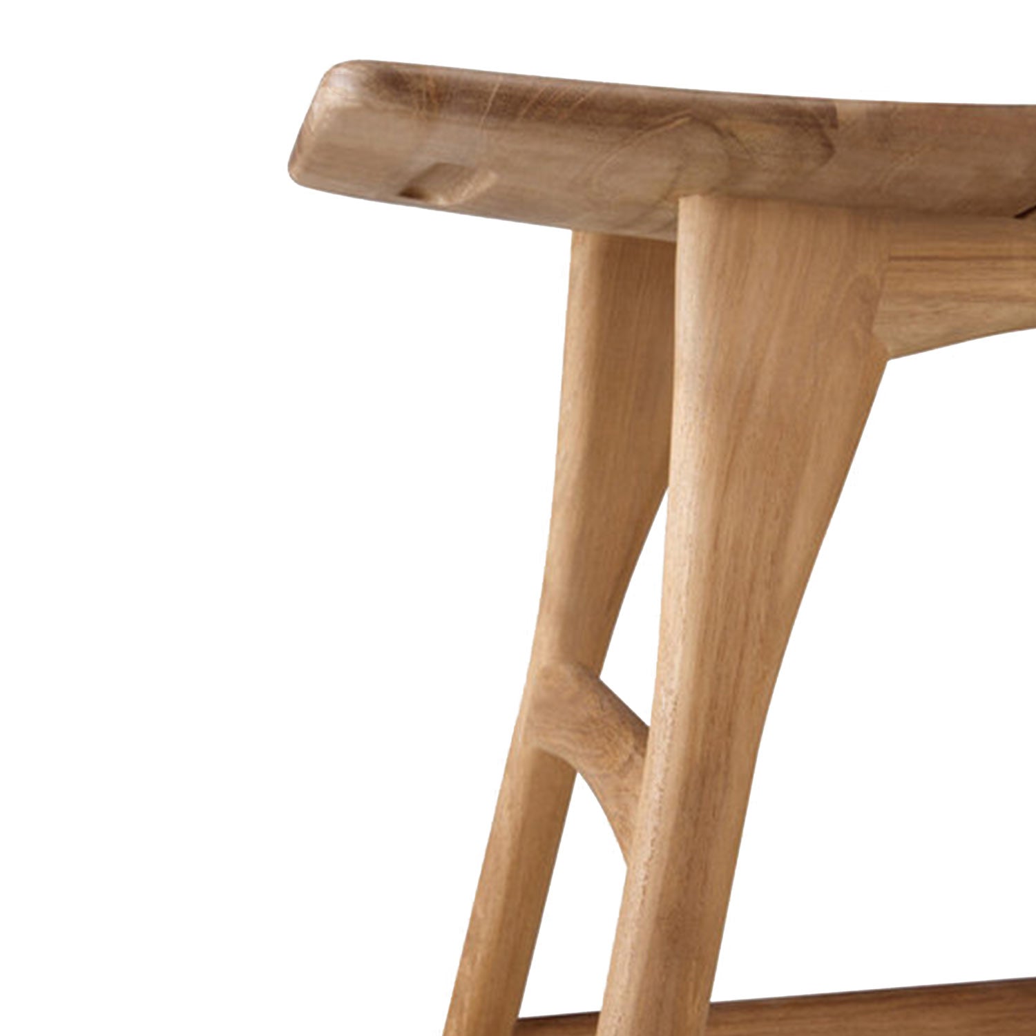 Close-up of a natural teak shower stool showing the rounded seat edge, tapered solid-wood legs and integrated footrest with smooth grain and light-brown finish.