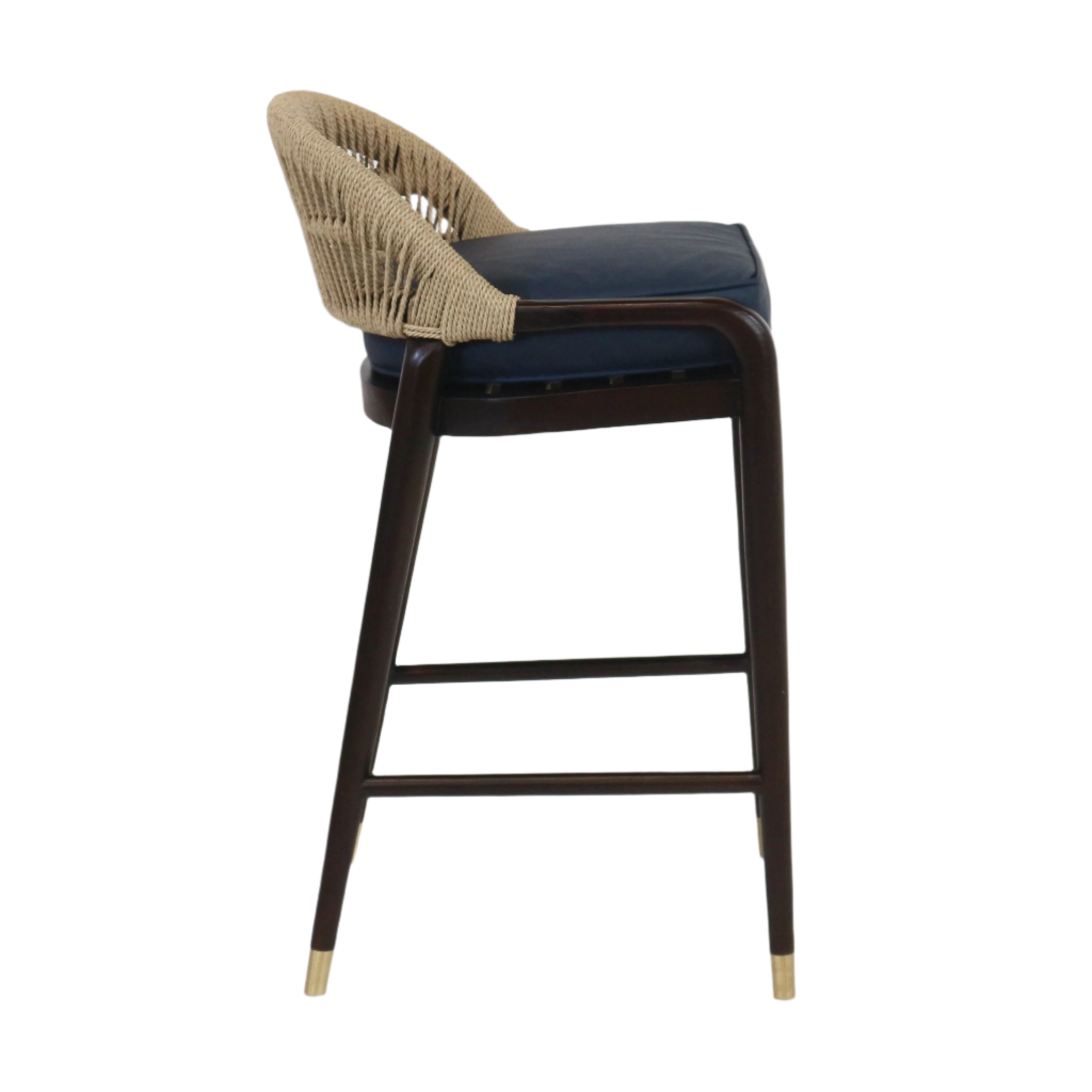 Side view of a teak-framed bar stool with a beige rope-wrapped low back, blue leather upholstered seat cushion, dark stained wooden legs with brass caps and a horizontal footrest.