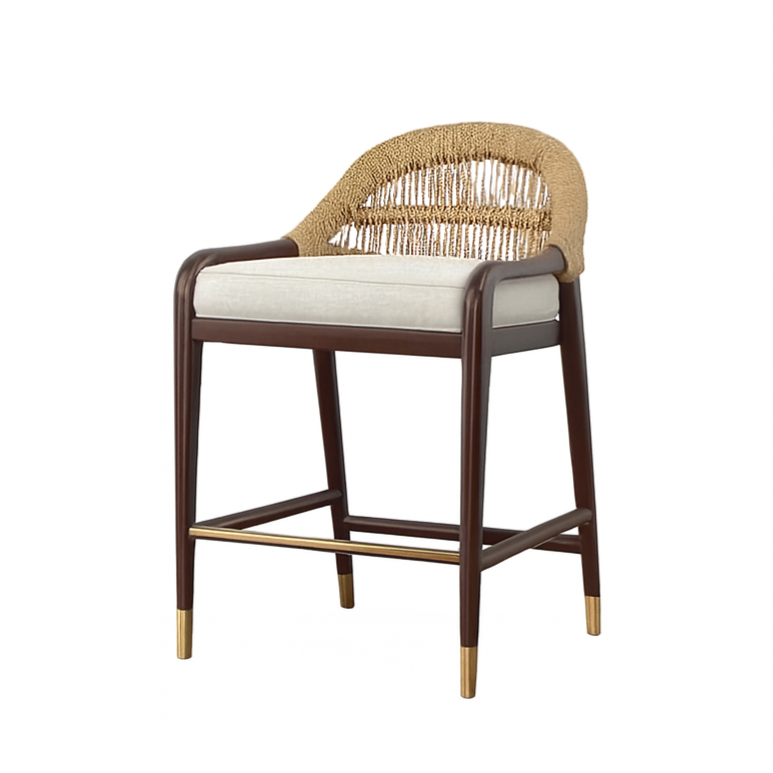 Teak-framed counter stool with woven rope back, beige upholstered seat cushion, curved teak arms, and brass footrest and leg caps, shown against a white background.