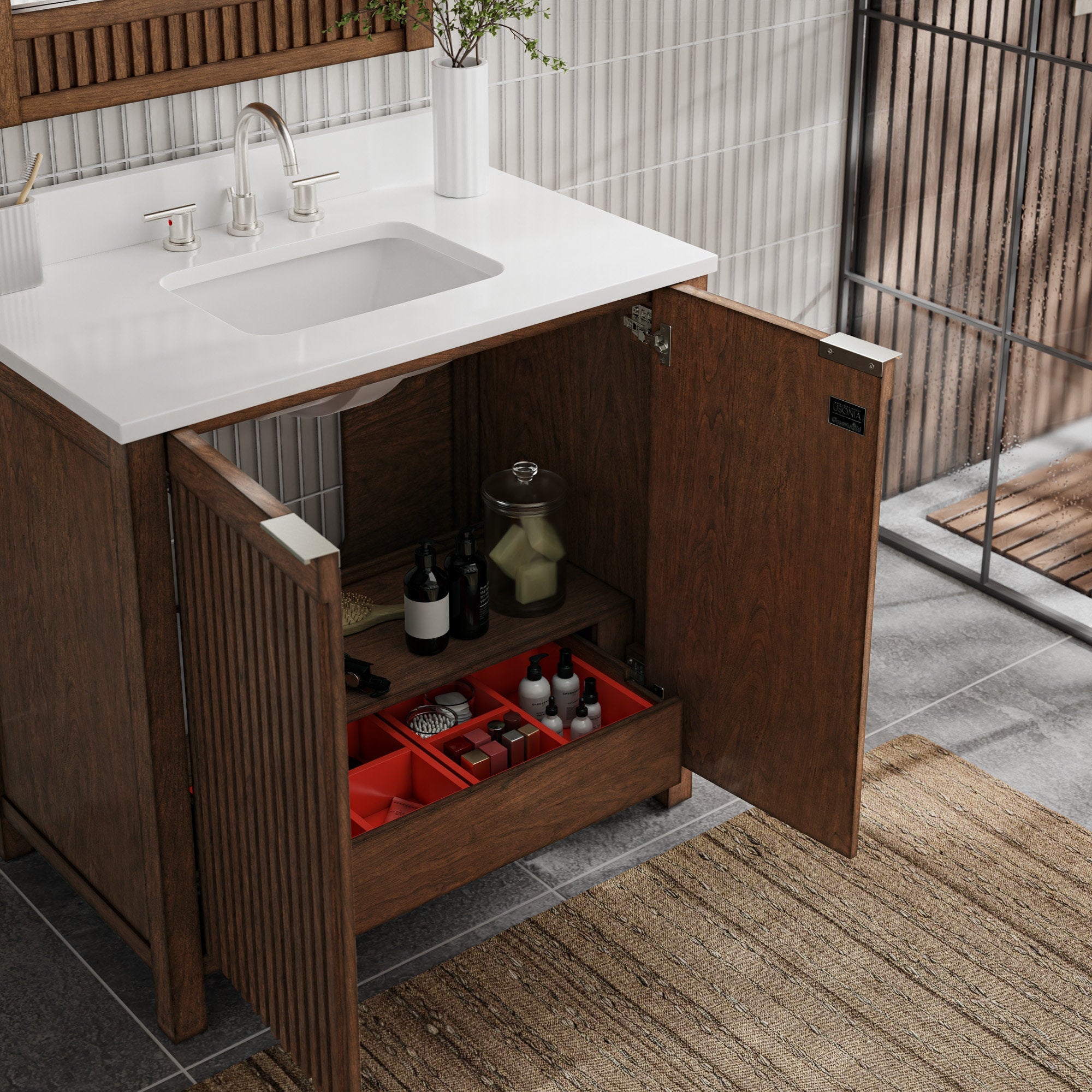 Open fluted solid-wood bathroom vanity with a white stone countertop and integrated rectangular sink, brushed-nickel faucet, and interior shelving with a red organizer holding toiletries.