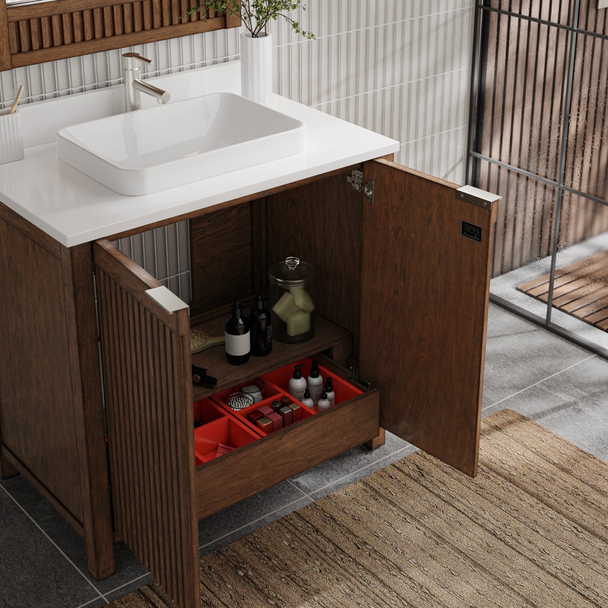 Modern solid-wood fluted bathroom vanity in warm brown with a stone top and white rectangular ceramic vessel sink; open cabinet doors reveal shelving, a red organizer tray and toiletry bottles.