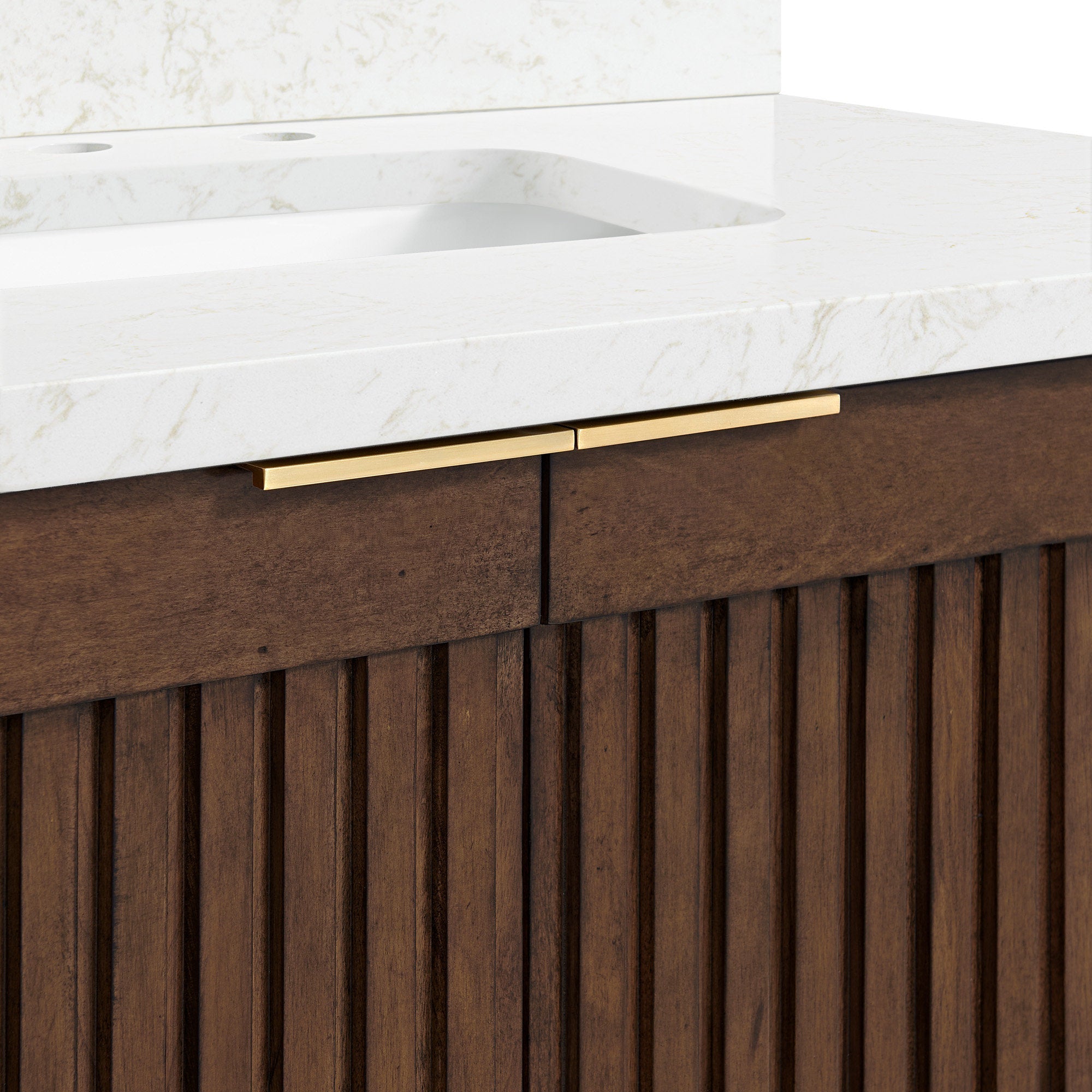 Close-up of a modern 36-inch bathroom vanity showing a stone-colored engineered marble countertop with integrated rectangular sink, solid natural wood fluted cabinet in warm brown and slim brushed brass drawer pulls.