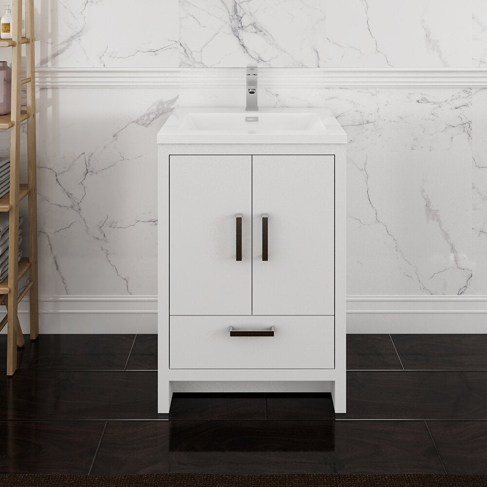 Freestanding 24-inch modern solid wood bathroom vanity in a stone/white finish with an integrated stone top and rectangular single sink, dark metal handles and chrome faucet, shown against a marble-look wall and dark floor.