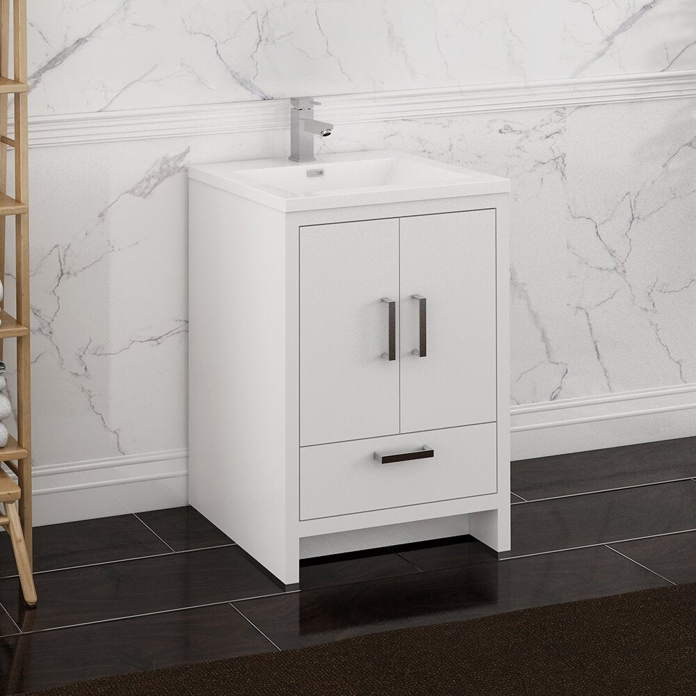 Freestanding solid wood 24-inch bathroom vanity in white with a stone top and integrated rectangular sink, two cabinet doors, a lower drawer, and brushed metal handles beneath a chrome faucet.