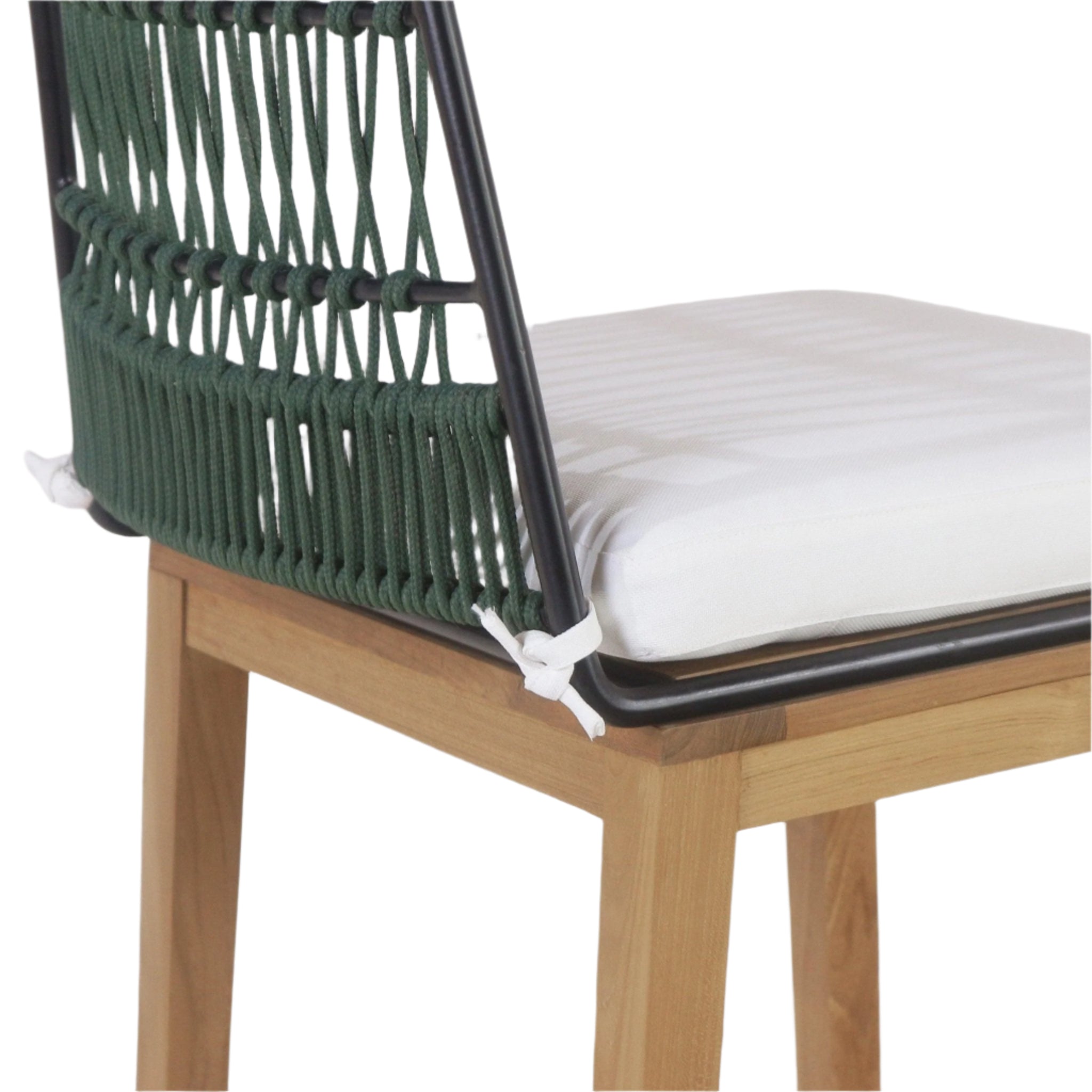 Close-up of an outdoor Mid-Century Modern bar stool showing a green rope-woven back on a black metal frame, natural teak legs and a white cushioned seat secured with tied fabric straps.