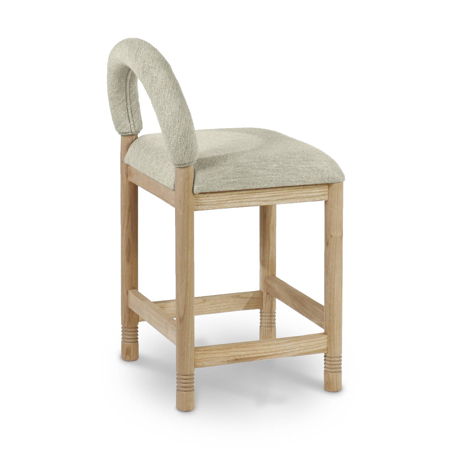 Beige boucle upholstered counter stool with a rounded arched back and cushioned seat, supported by natural oak square legs with stretcher bars and subtle carved ring details at the feet.