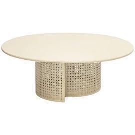 Low round coffee table with a smooth stone-colored top and a cylindrical woven rattan base in teak tone, modern-contemporary style for living room use.