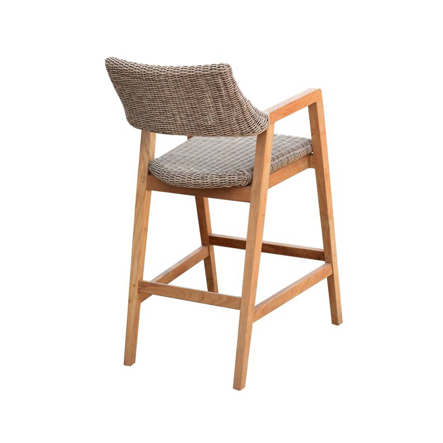 Three-quarter rear view of a teak outdoor bar stool with a natural wood frame, gray woven rope seat and curved woven back, angled armrests and built-in footrest for coastal counter-height seating.