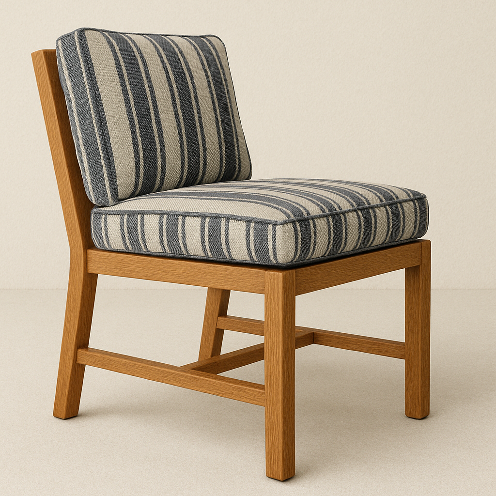 Armless outdoor dining chair with a warm teak wood frame and navy-and-beige striped fabric seat and back cushions, shown on a neutral background.