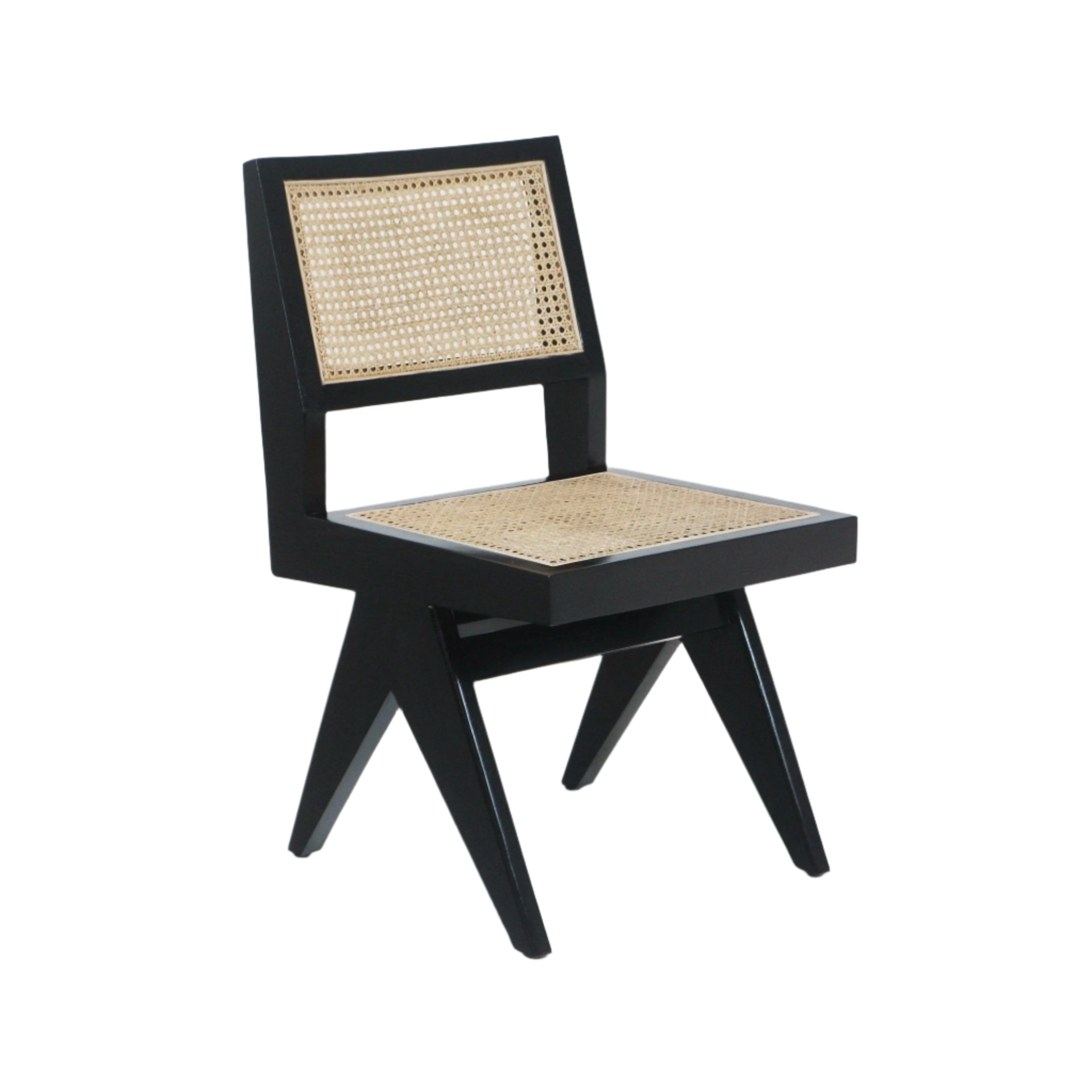 Armless dining side chair with a black solid wood frame and natural woven cane seat and back, sculptural mid-century modern silhouette with angled legs.