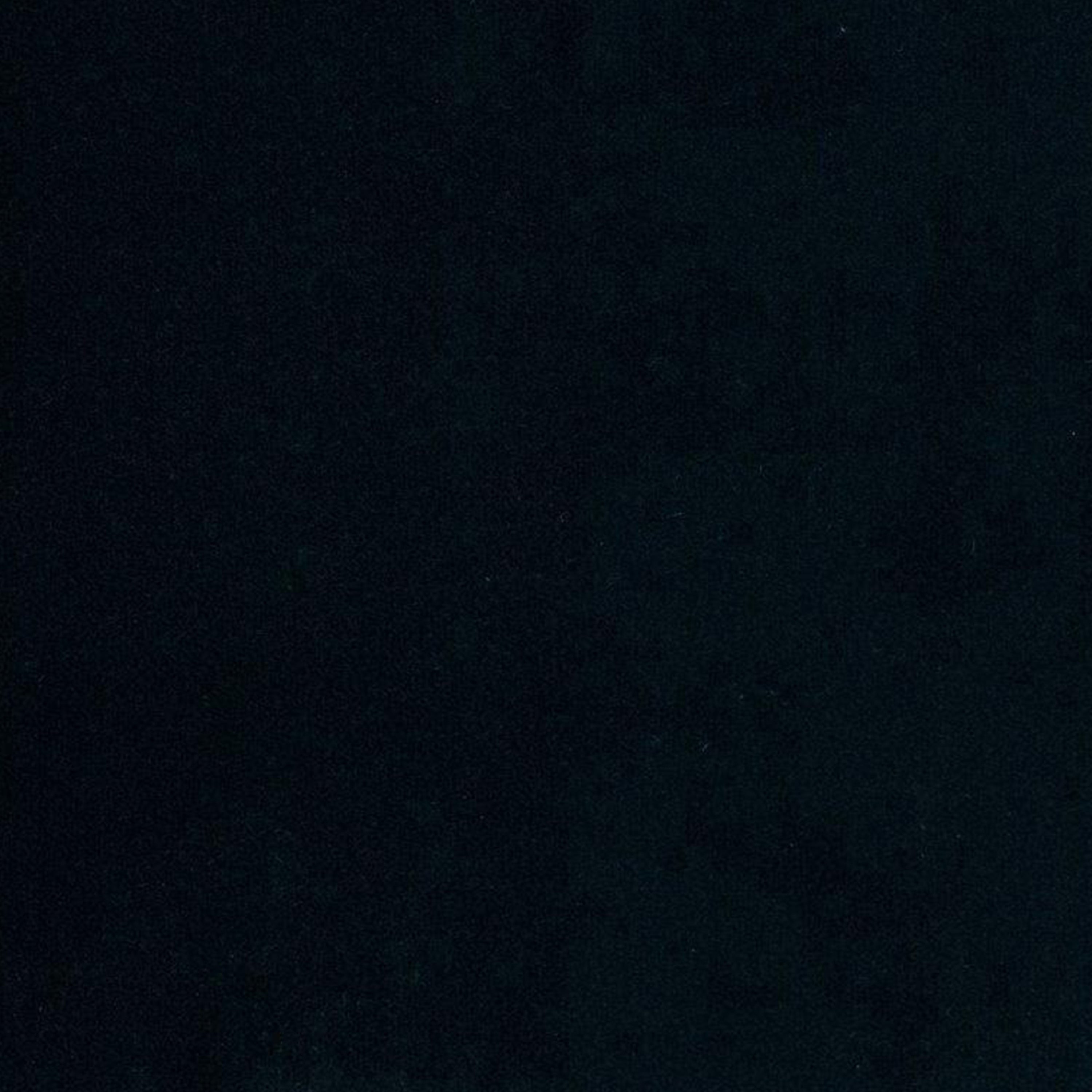 Close-up of black velvet upholstery fabric swatch showing smooth, solid texture intended for a modern dining chair.